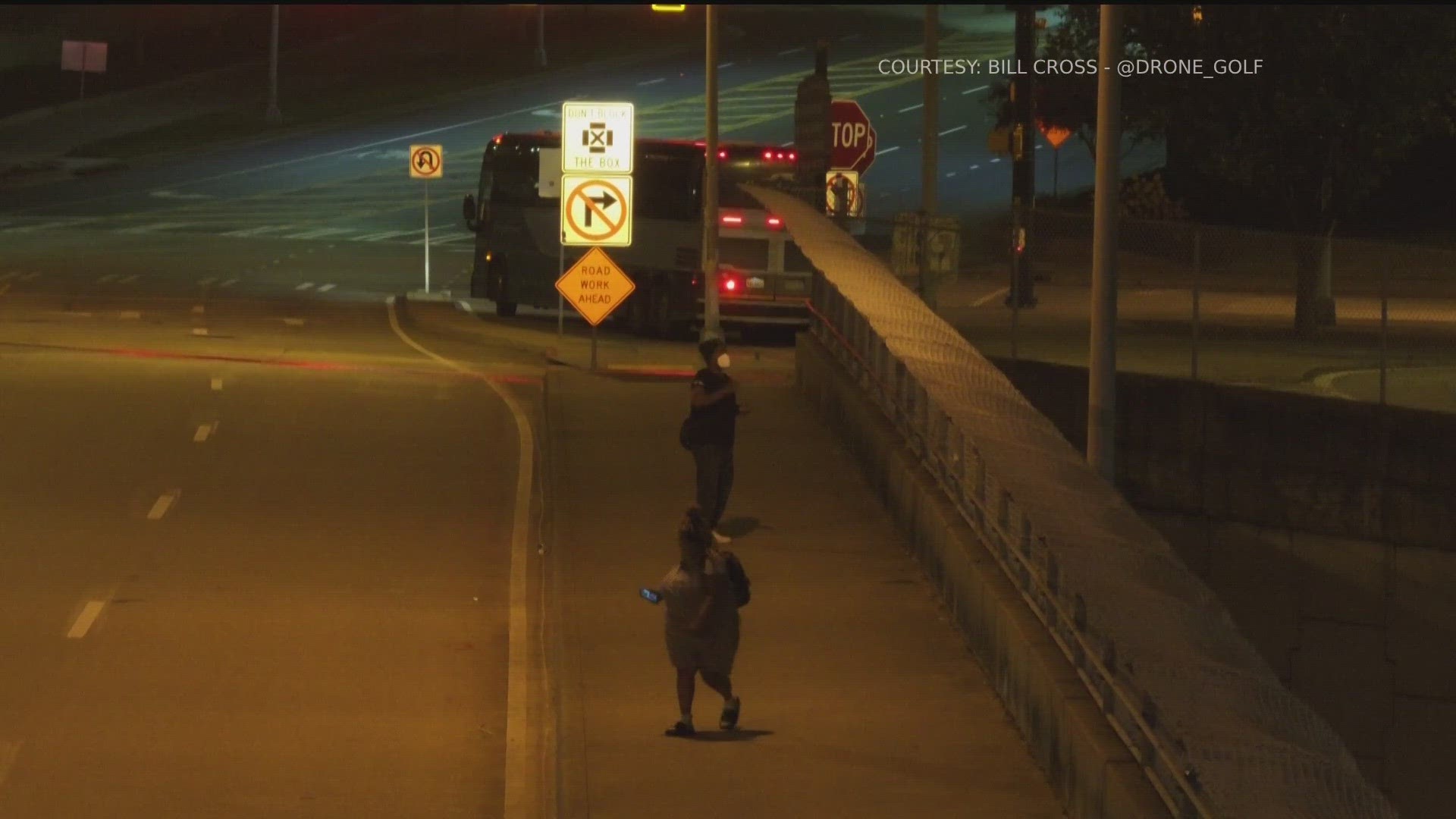 Drone video caught a man throwing rocks from the bridge.