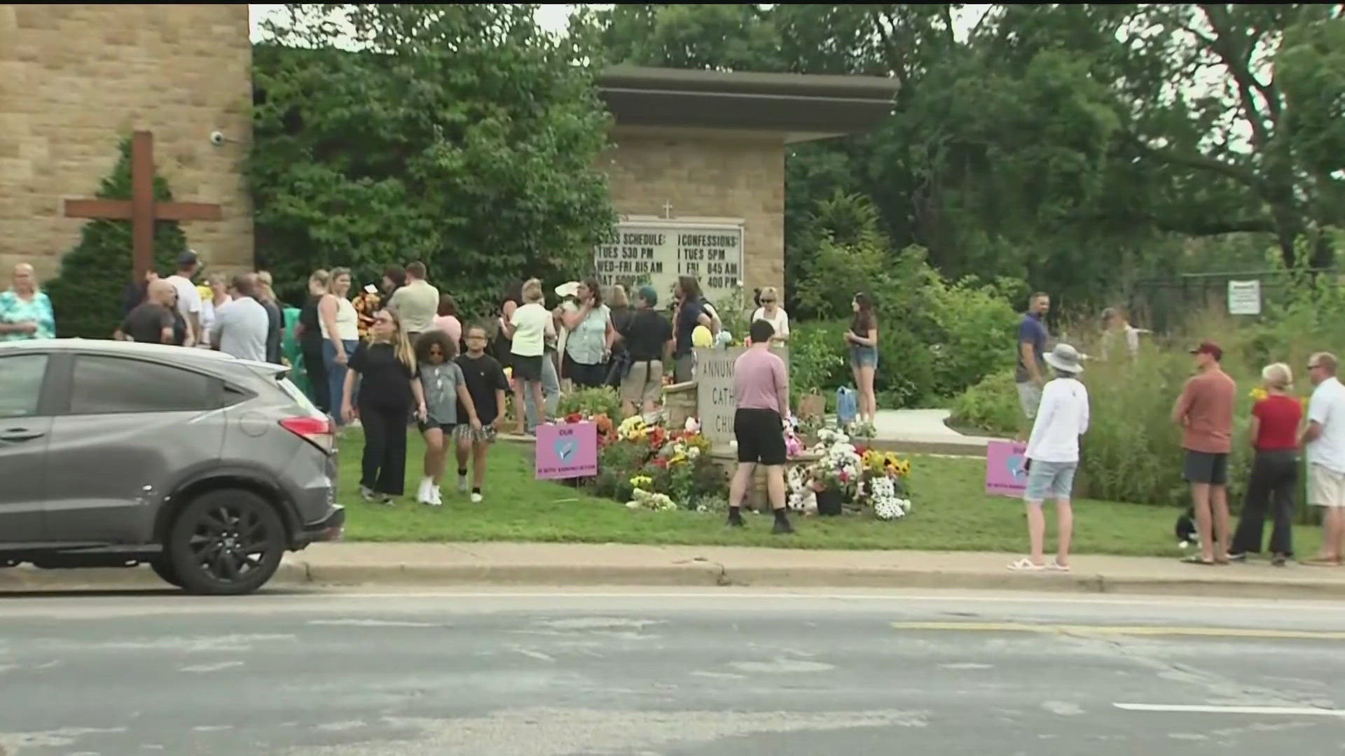 Hundreds gathered at multiple vigils to remember the two children killed and 17 injured in a shooting at Annunciation church in Minneapolis. 