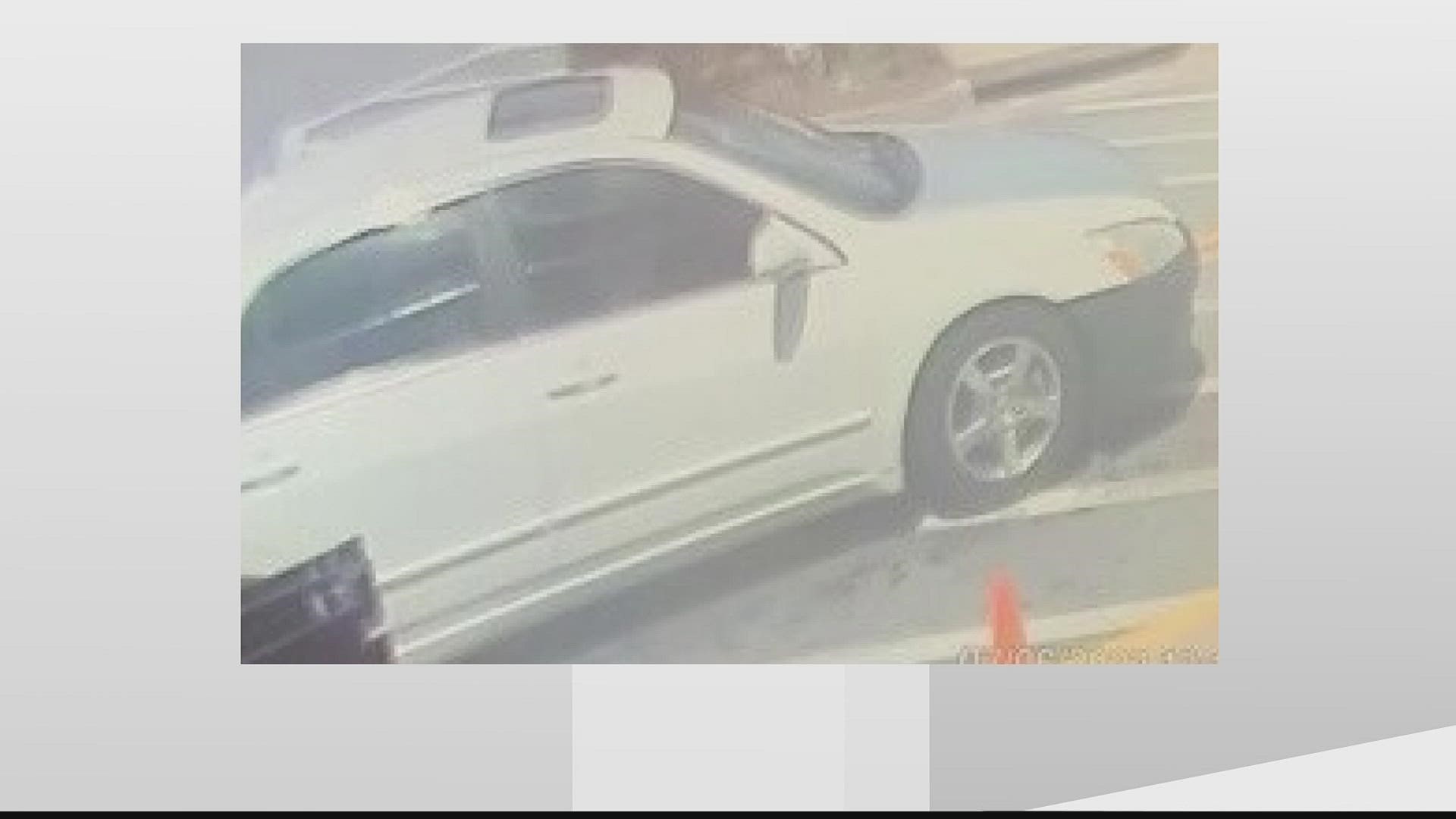 The car is a white Honda sedan with a back front bumper, a gray hood and a sunroof, according to the department.