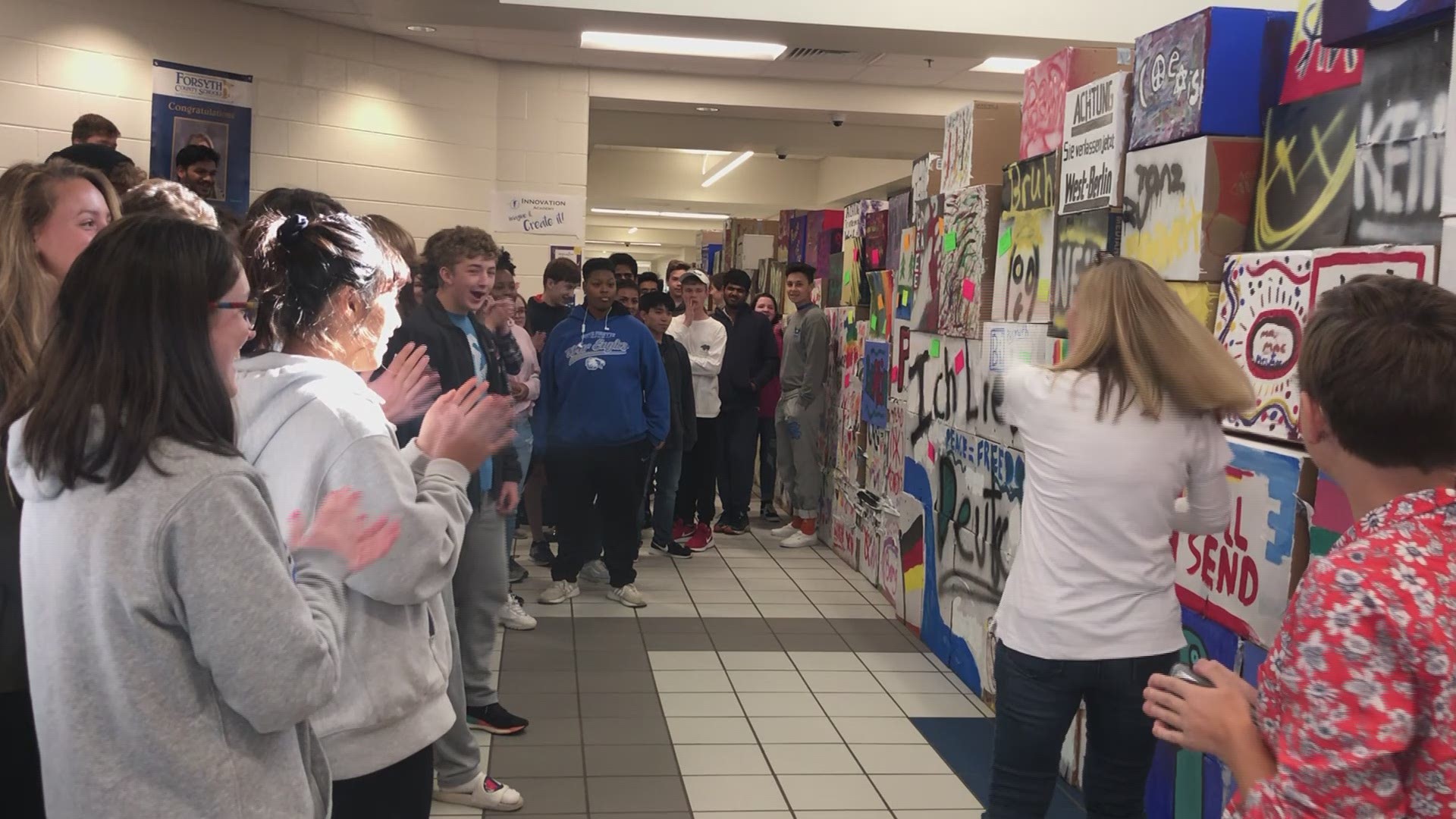 Video of students at South Forsyth High School tearing down their Berlin Wall replica.