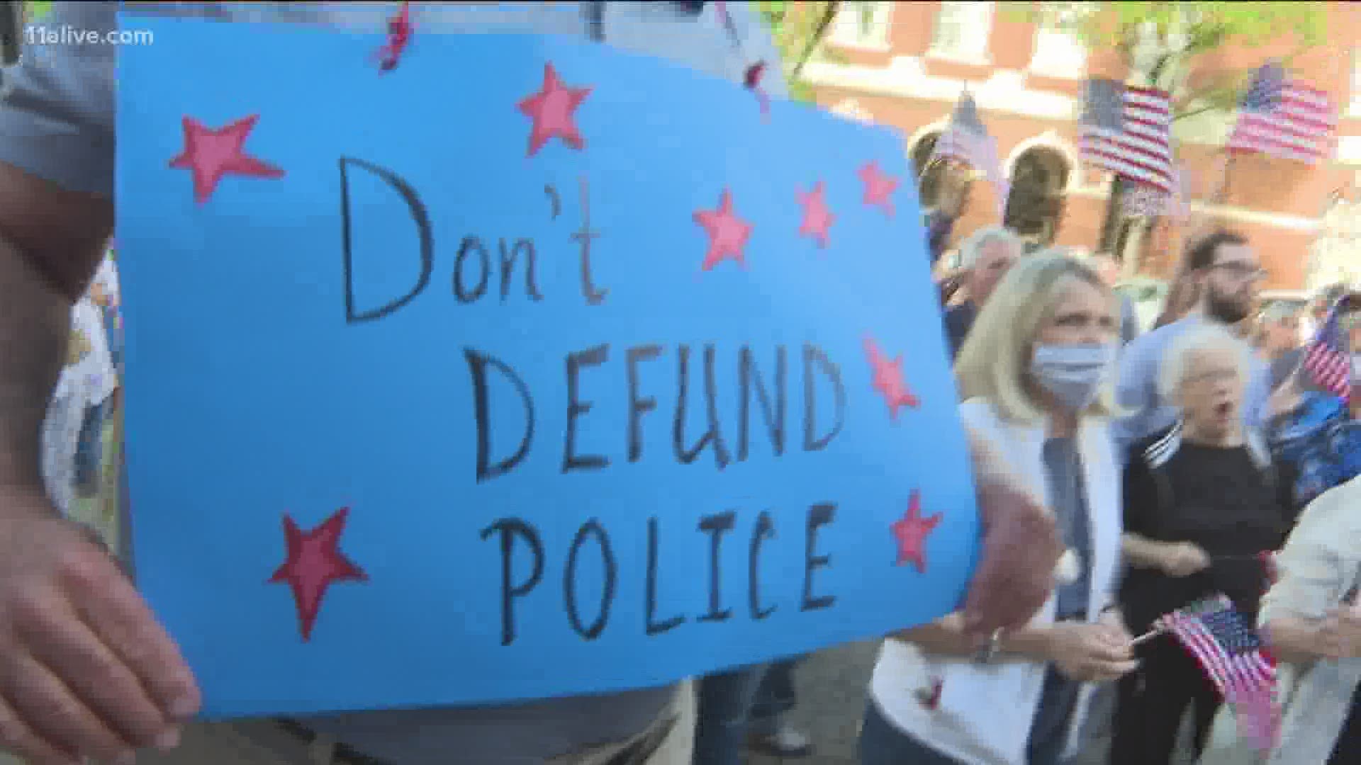 Crowds who showed up at City Hall were divided about the proposal to defund police