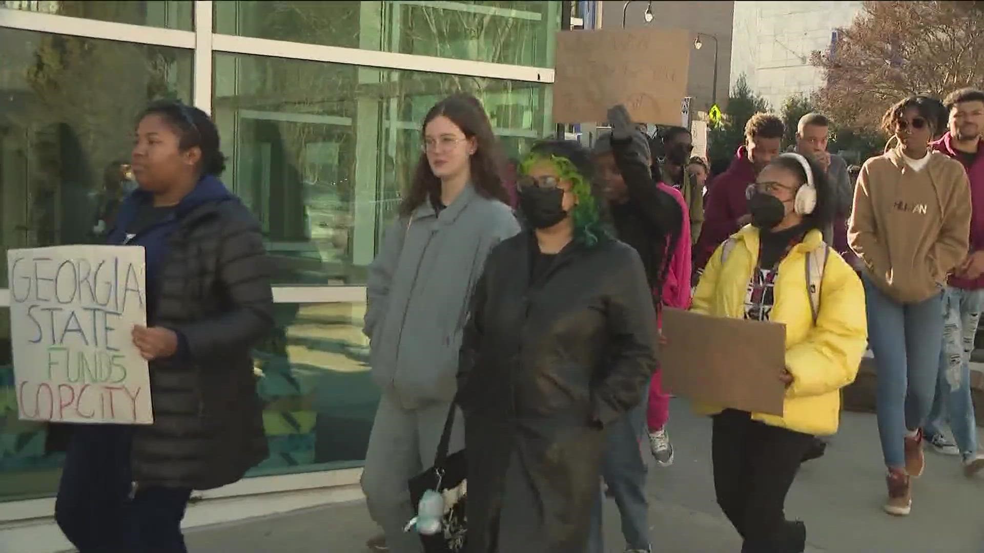 About 50 people gathered downtown near the Georgia State University campus-- calling for the project to be halted.