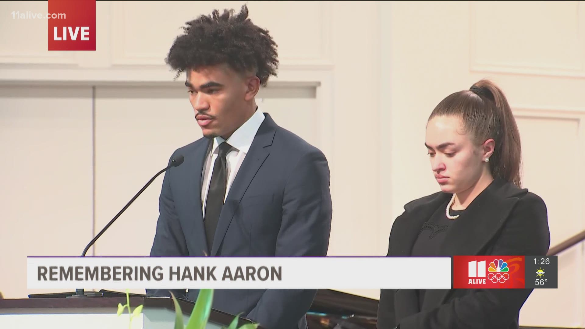 Victor Aaron Haydel reads the Old Testament and Emily Haydel reads the New Testament during the funeral at Friendship Baptist Church.