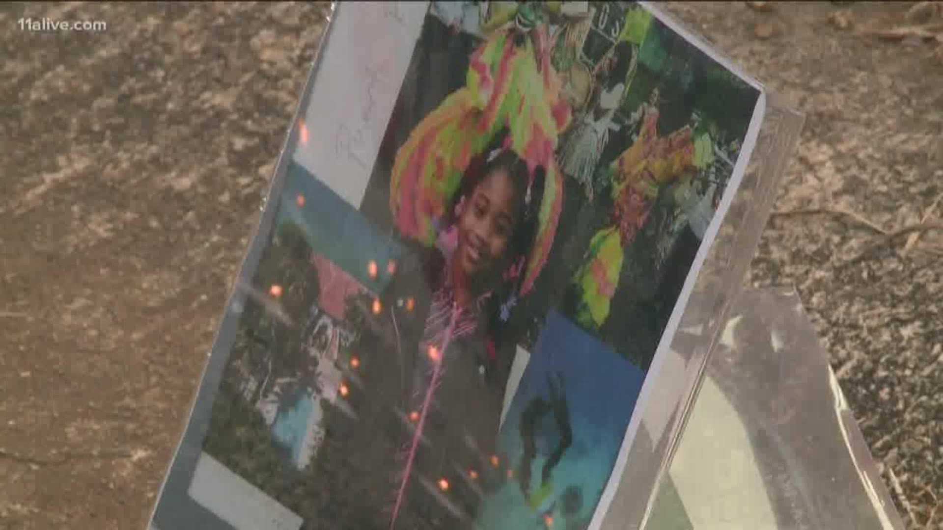 A vigil was held to honor the 7-year-old who died after her foster parents' home was hit by bullets.