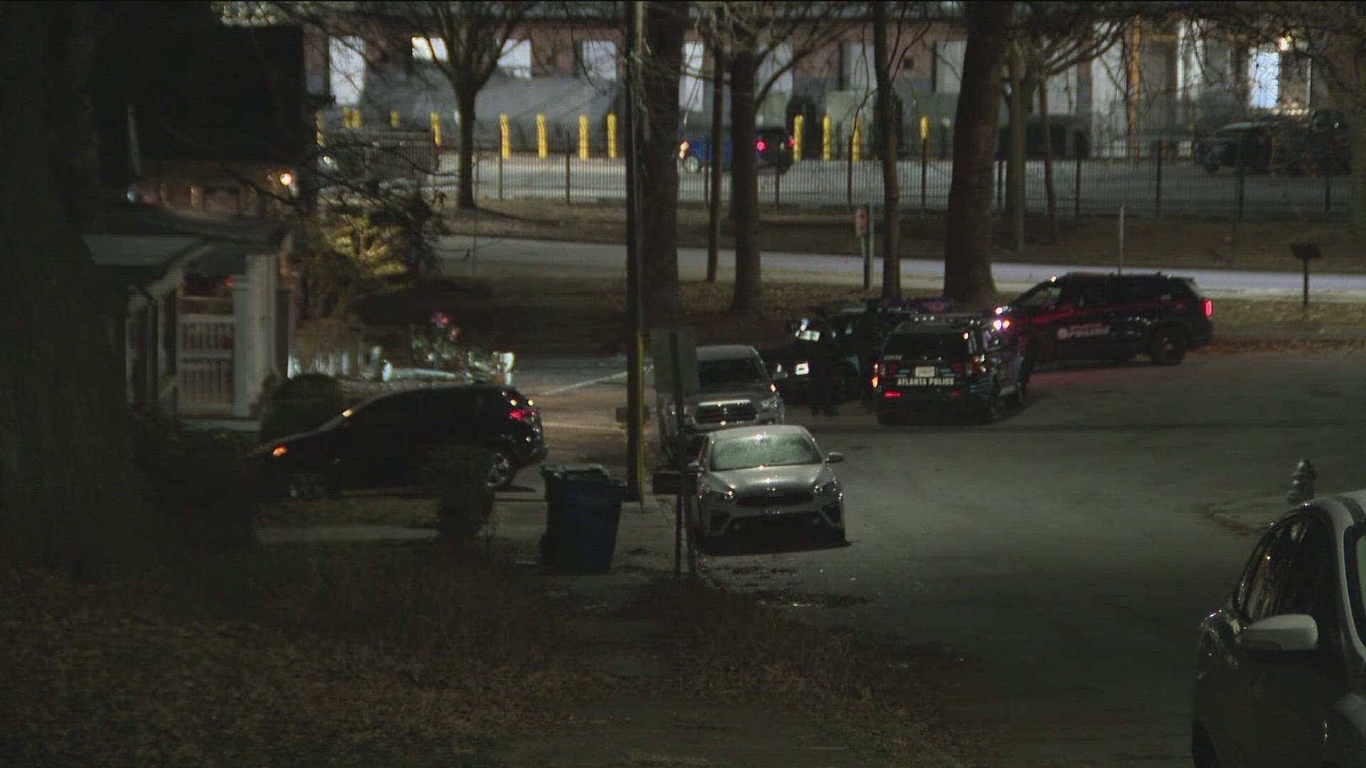 Many Atlanta Police Department cars can be seen around a home on Queen Street.