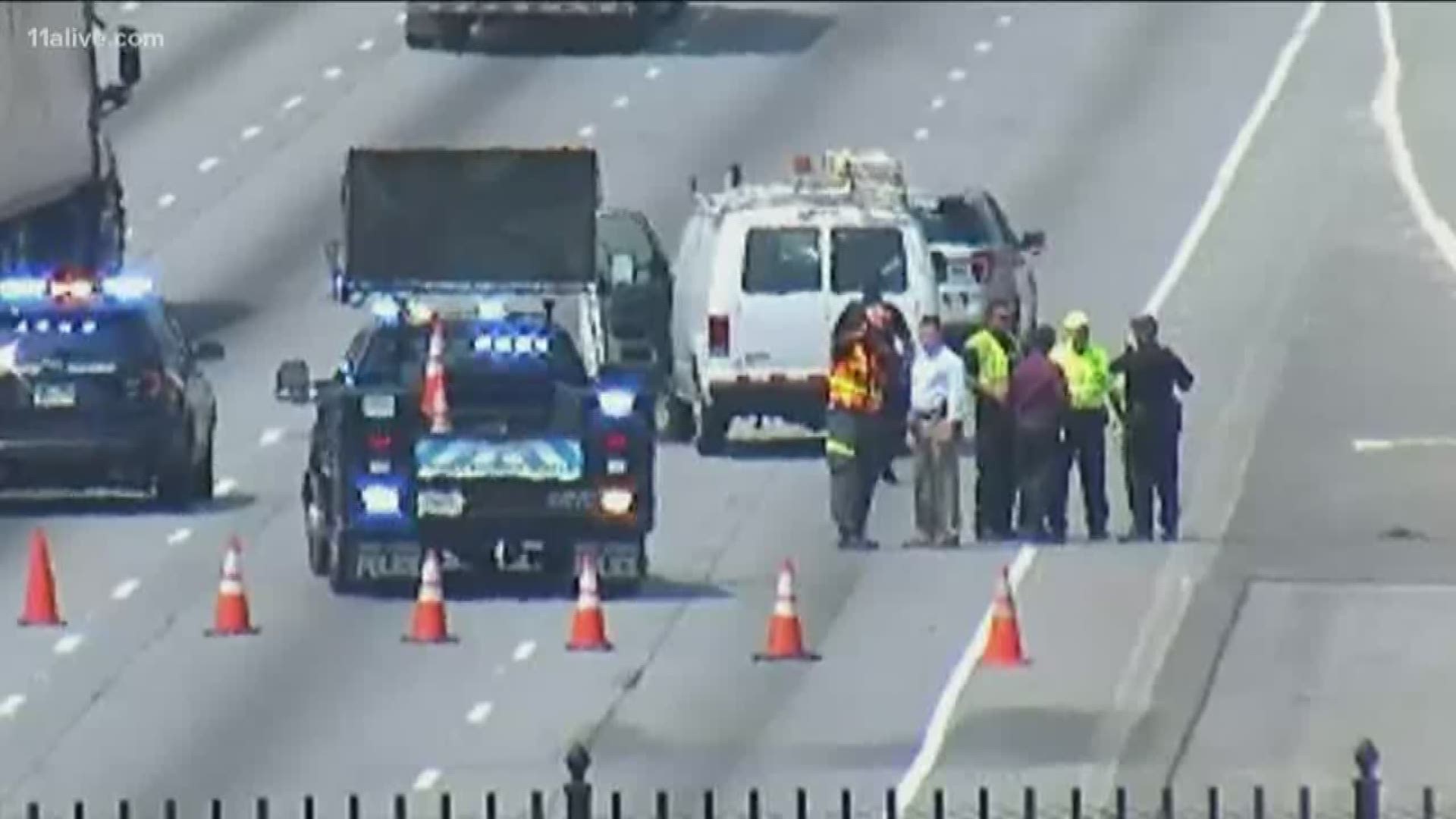 At around 11:30 a.m., authorities confirmed that two officers pulled over a vehicle on Ashford Dunwoody at I-285 for a texting and driving violation. The driver fled and dragged one of the officers onto I-285.