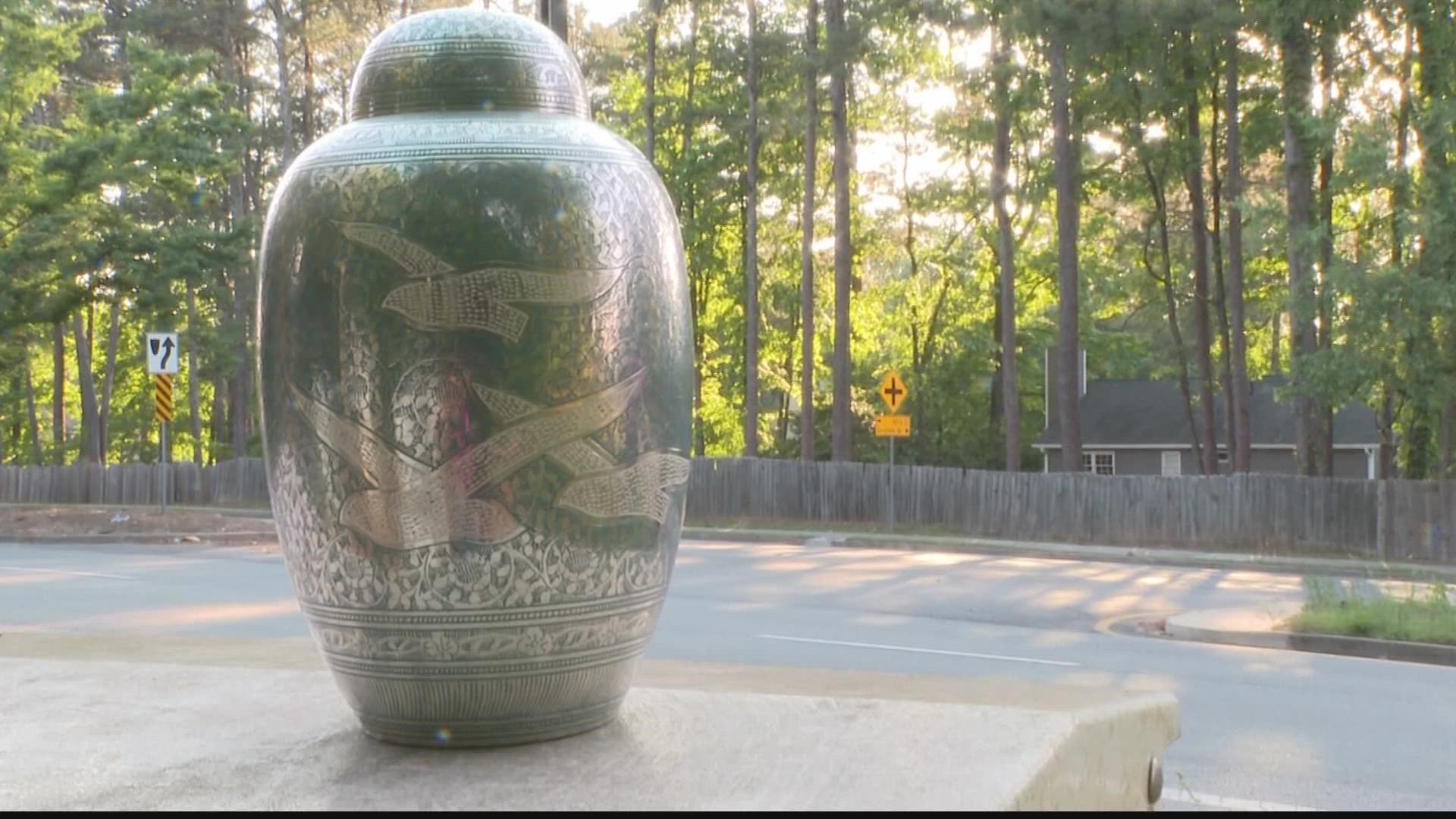 A Cobb County woman came across a turquoise urn while on her daily walk Tuesday night. Now, she's trying to get it back to its owner.