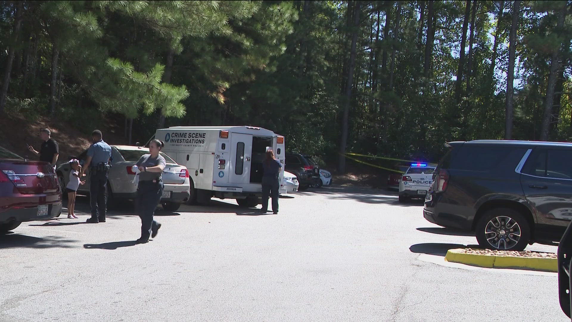 Authorities investigated the shooting at the Bugetel Inn & Suites at 4350 Stone Mountain Hwy.