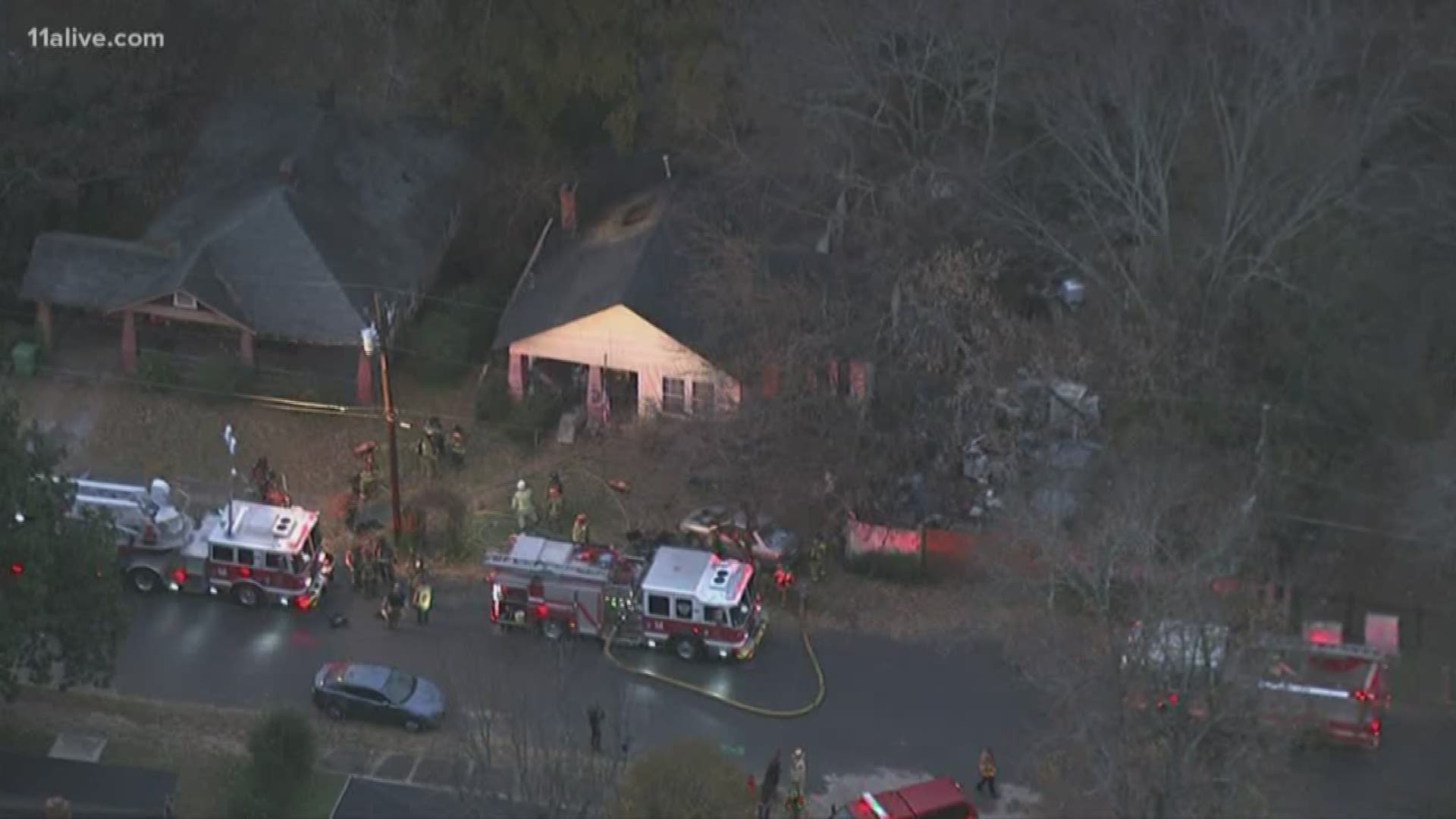 Firefighters are working at the scene of an apparent house fire in Southwest Atlanta where at least one person was critically injured.