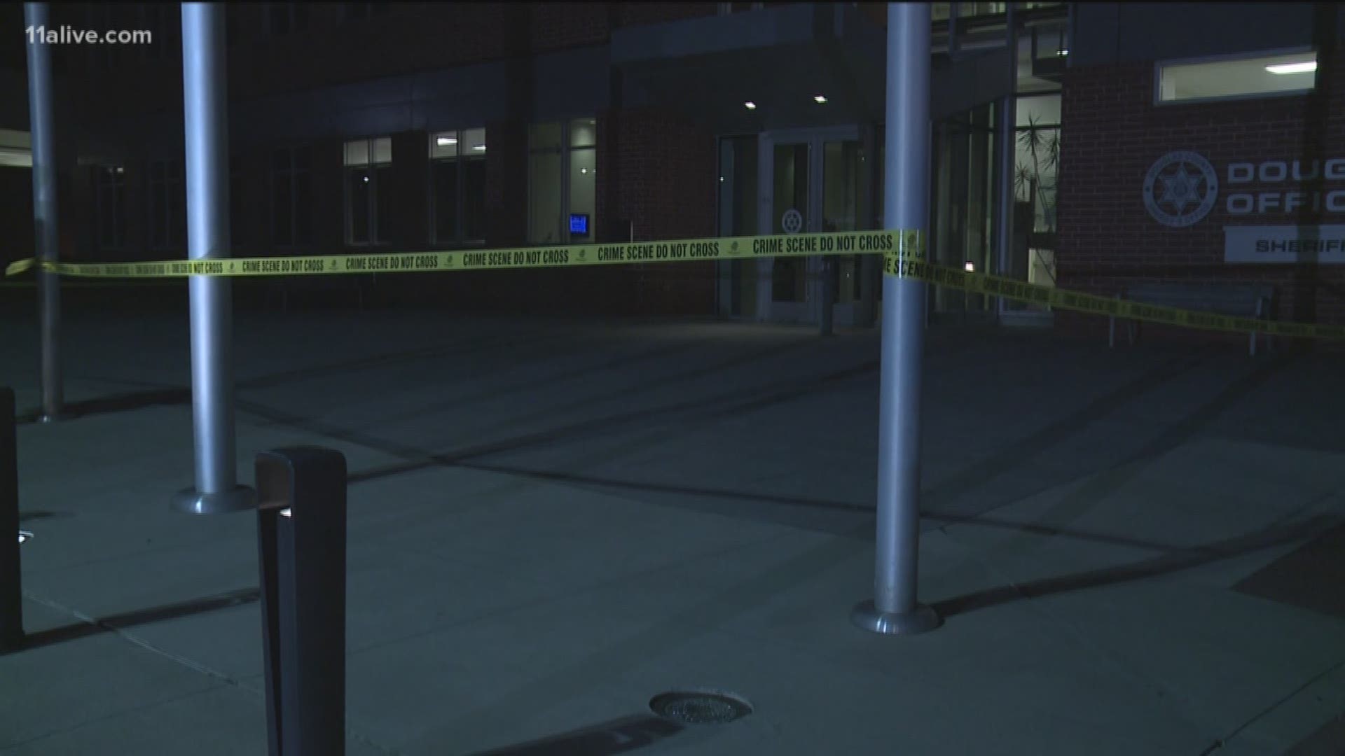 A man is dead after he entered the Douglas County Sheriff's Office and stabbed a deputy and wounded a commander.