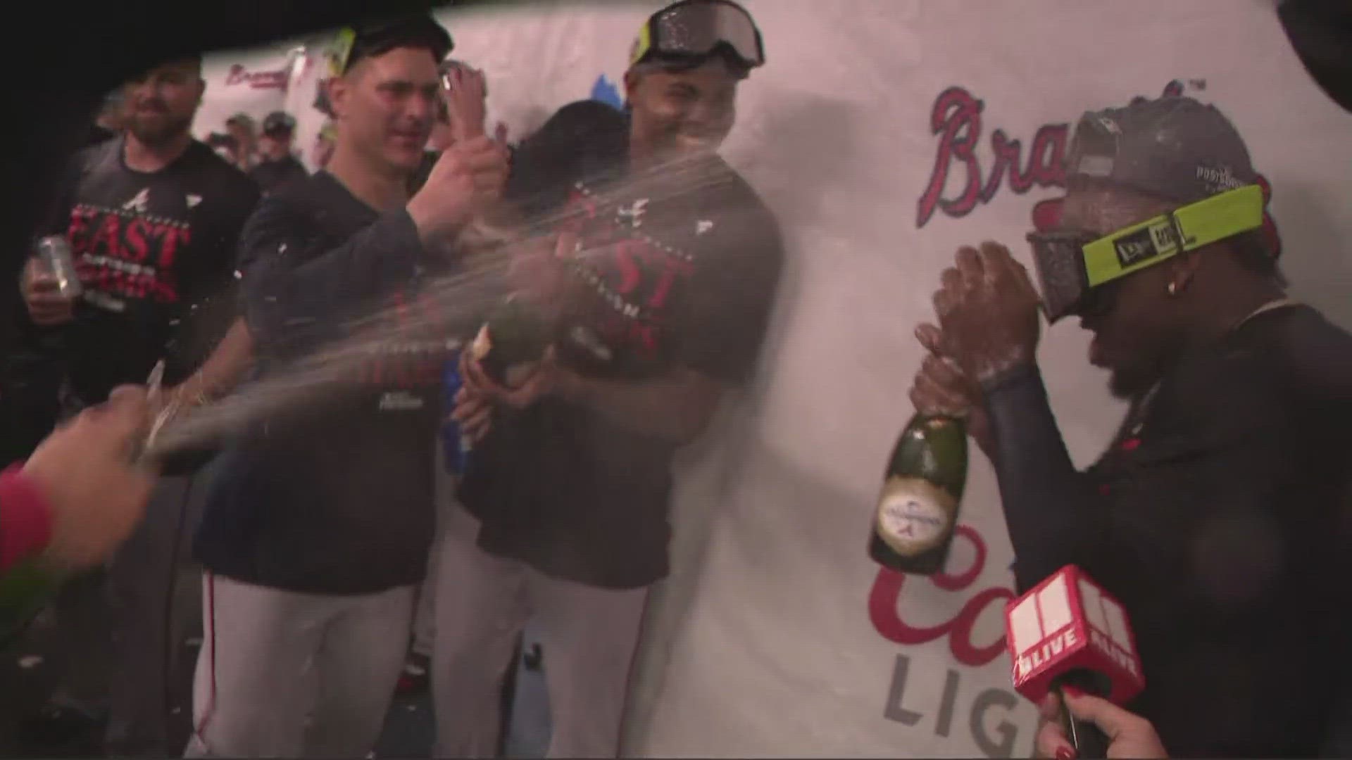 Ozzie Albies gets drenched in champagne