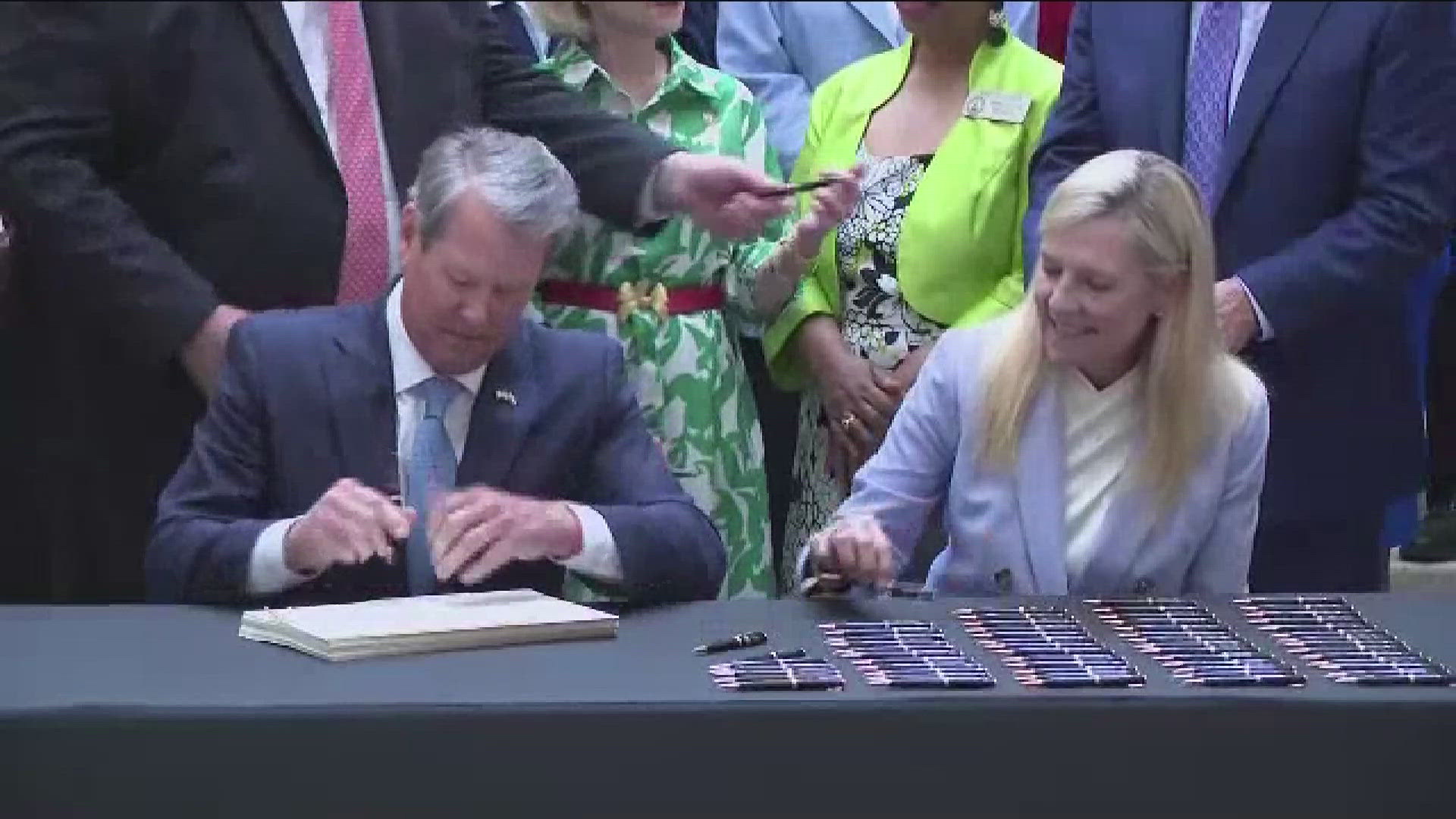 Gov. Kemp signed the state budget on Tuesday under the gold dome with pay raises for public school teachers.