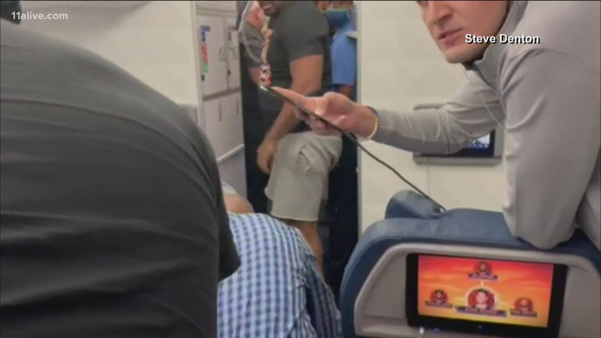 Social media video shows passengers helping get control of the man on Flight 1730 Friday night.