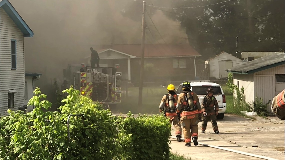 Crews clear neighborhood roadway to battle large house fire | 11alive.com