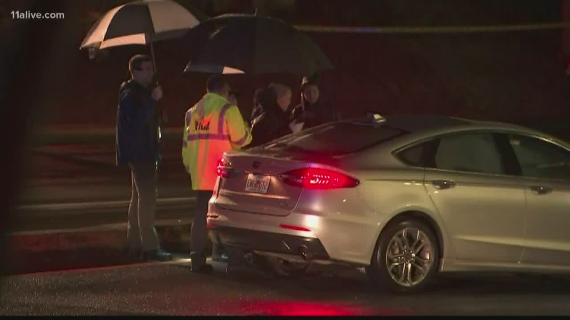 Police say a 20-year-old Lawrenceville man was shot at a gas station then crashed his car up the road.