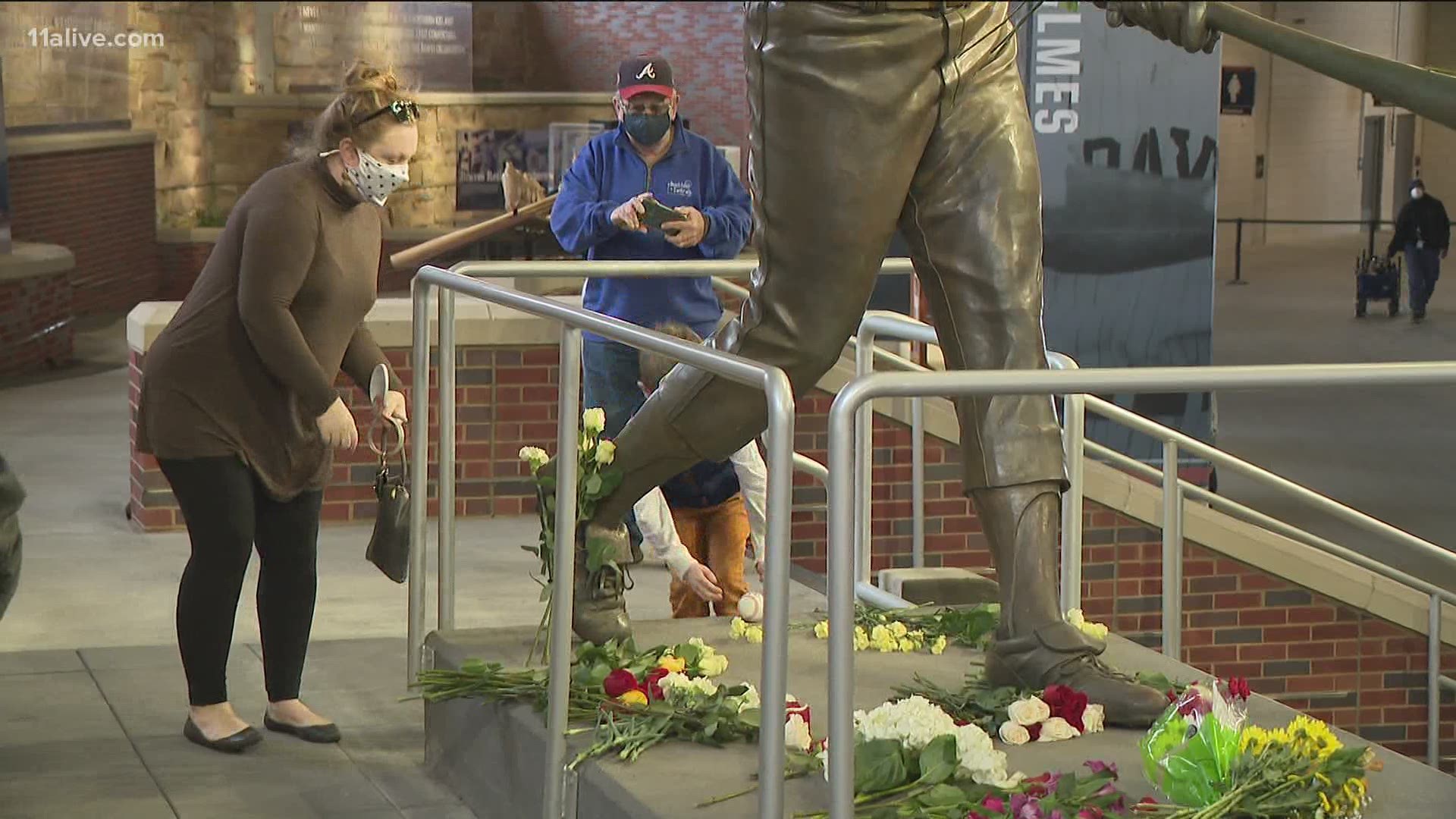 From President Joe Biden to fans in Atlanta, many are taking a moment to stop and honor the baseball legend.