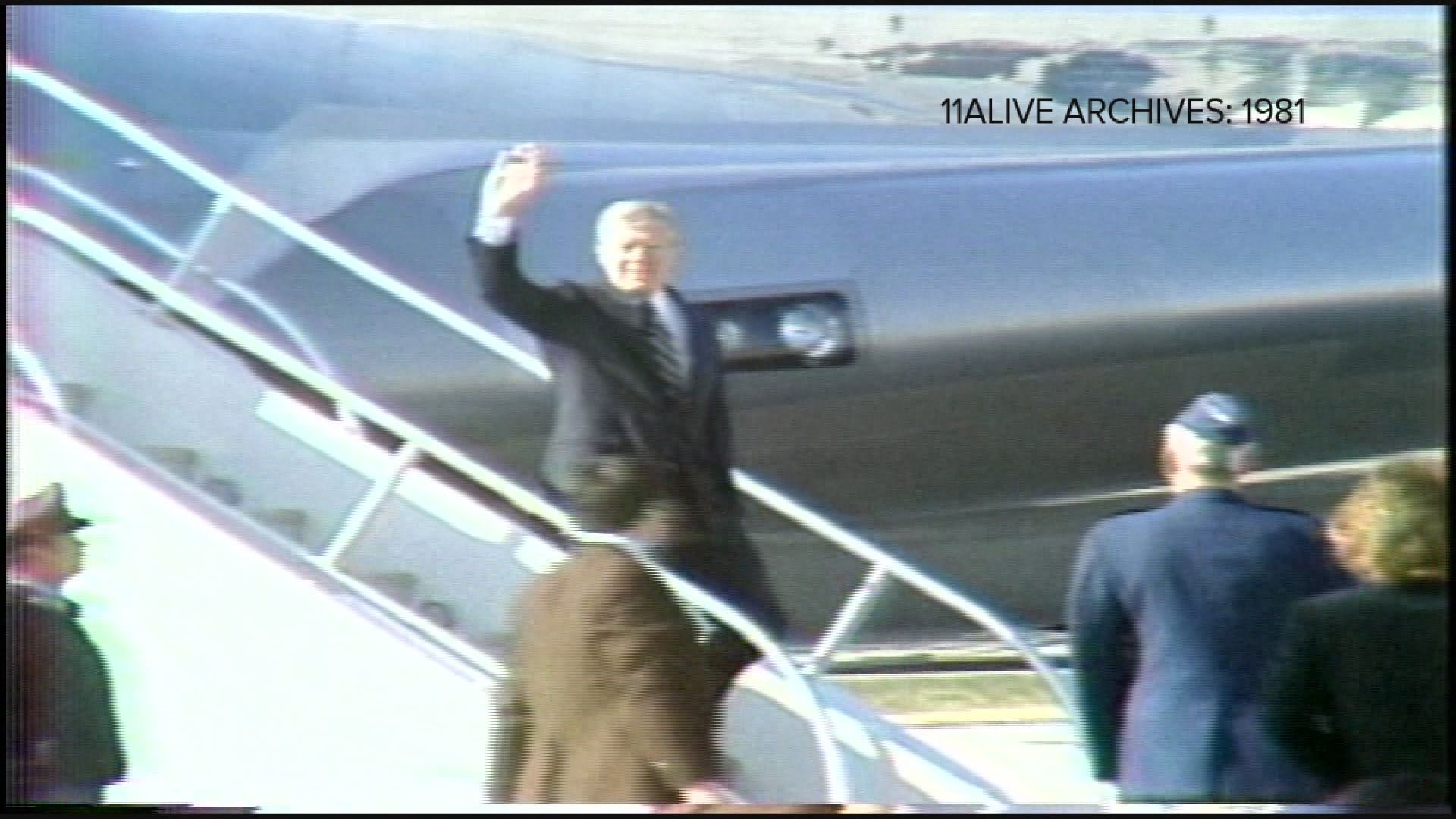 This 1981 video shows Carter, the former president, greet guests at Dobbins. He made a stop in Atlanta to pick up a group who will attend the game in New Orleans.