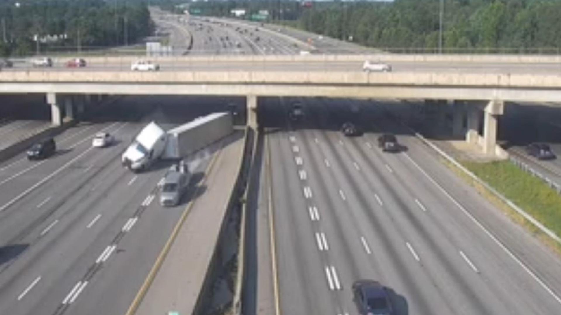 The 18-wheeler collided with a pickup truck and went spiraling out of control on Interstate 85 in Gwinnett County.