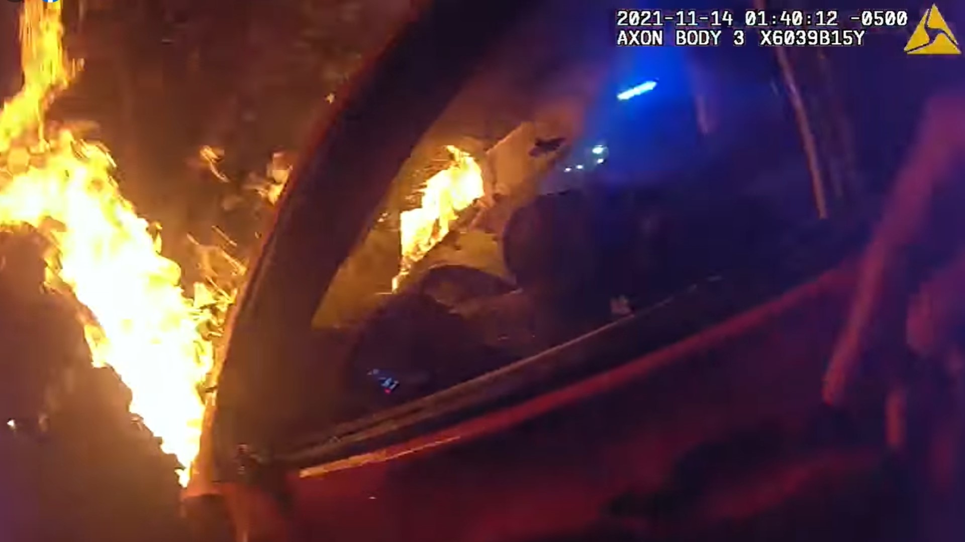 The officers rushed to help a man trapped inside his burning car early Sunday morning.