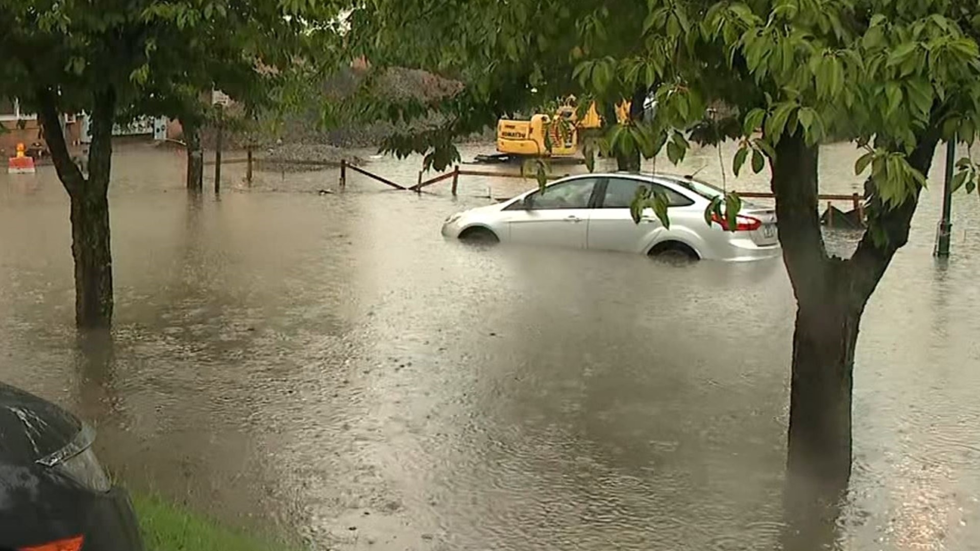 Officials say strong storms caused the flooding in Chattanooga, Tennessee, knocking down trees and power lines and leaving drivers stranded.