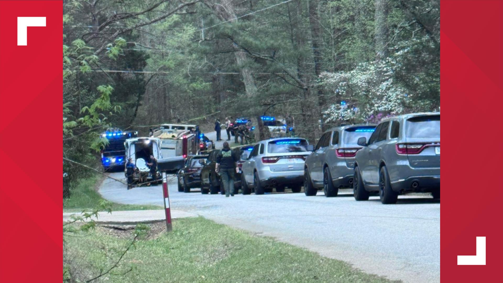 Armed suspect in custody after firing shots at multiple people, homes ...