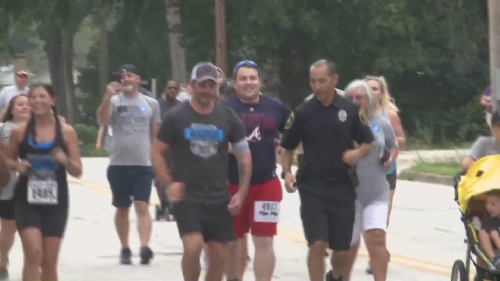 Less than a year ago, Covington Police Officer Matt Cooper was laying in a hospital bed, fighting for his life after he had been shot in the face by a shoplifting suspect. On Saturday, he ran in Covington's 36th annual Fuzz Run, which supports injured officers as they recover from injuries like his.