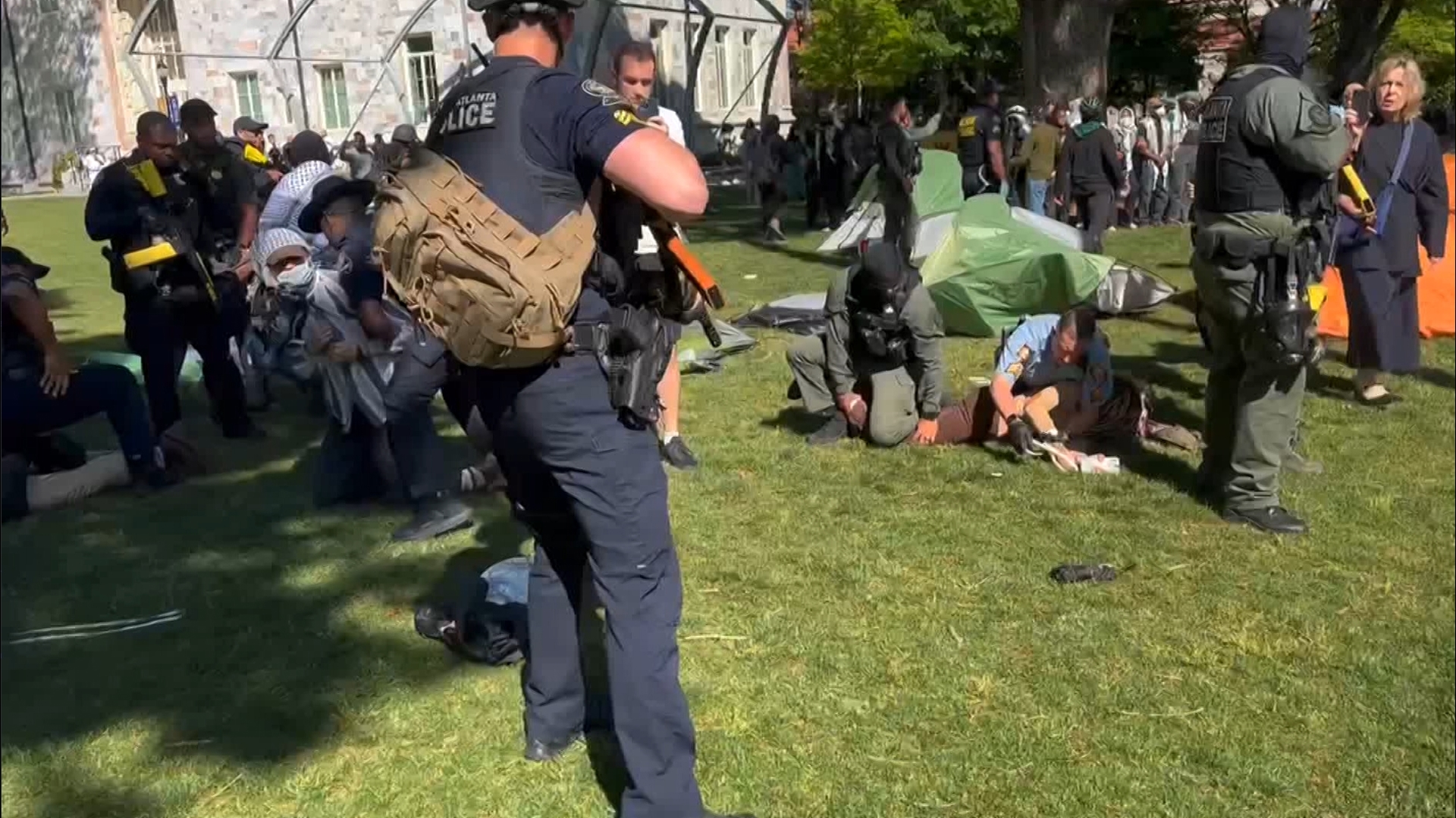Protesters seen being arrested by Atlanta Police during demonstrations on Emory University campus. (Credit: CNN Newsource)