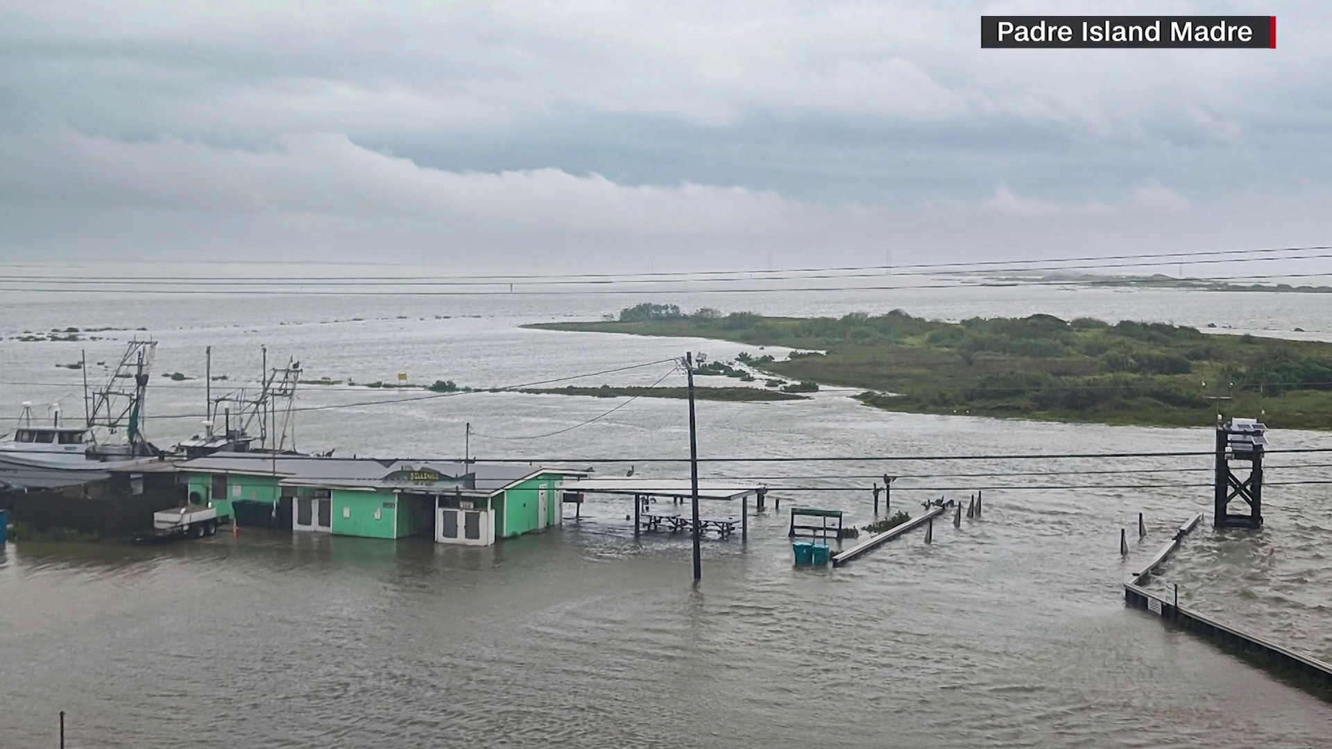 Roadways and parking lots disappeared as Tropical Storm Alberto brought coastal flooding around Corpus Christi on Wednesday.