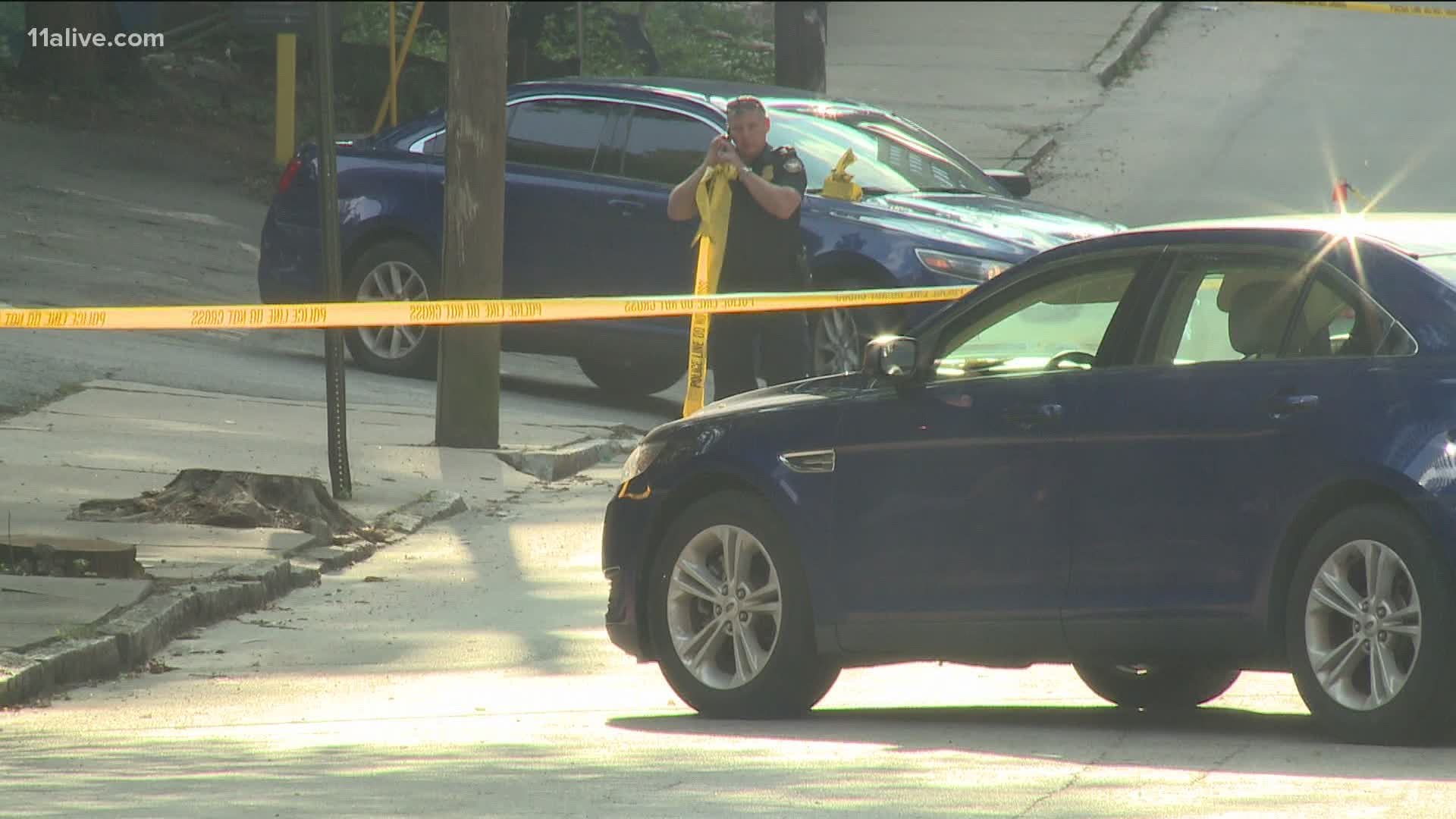 The gunfire happened in the heart of one of Atlanta's busiest districts after a suspect allegedly tried to hit police with a car.