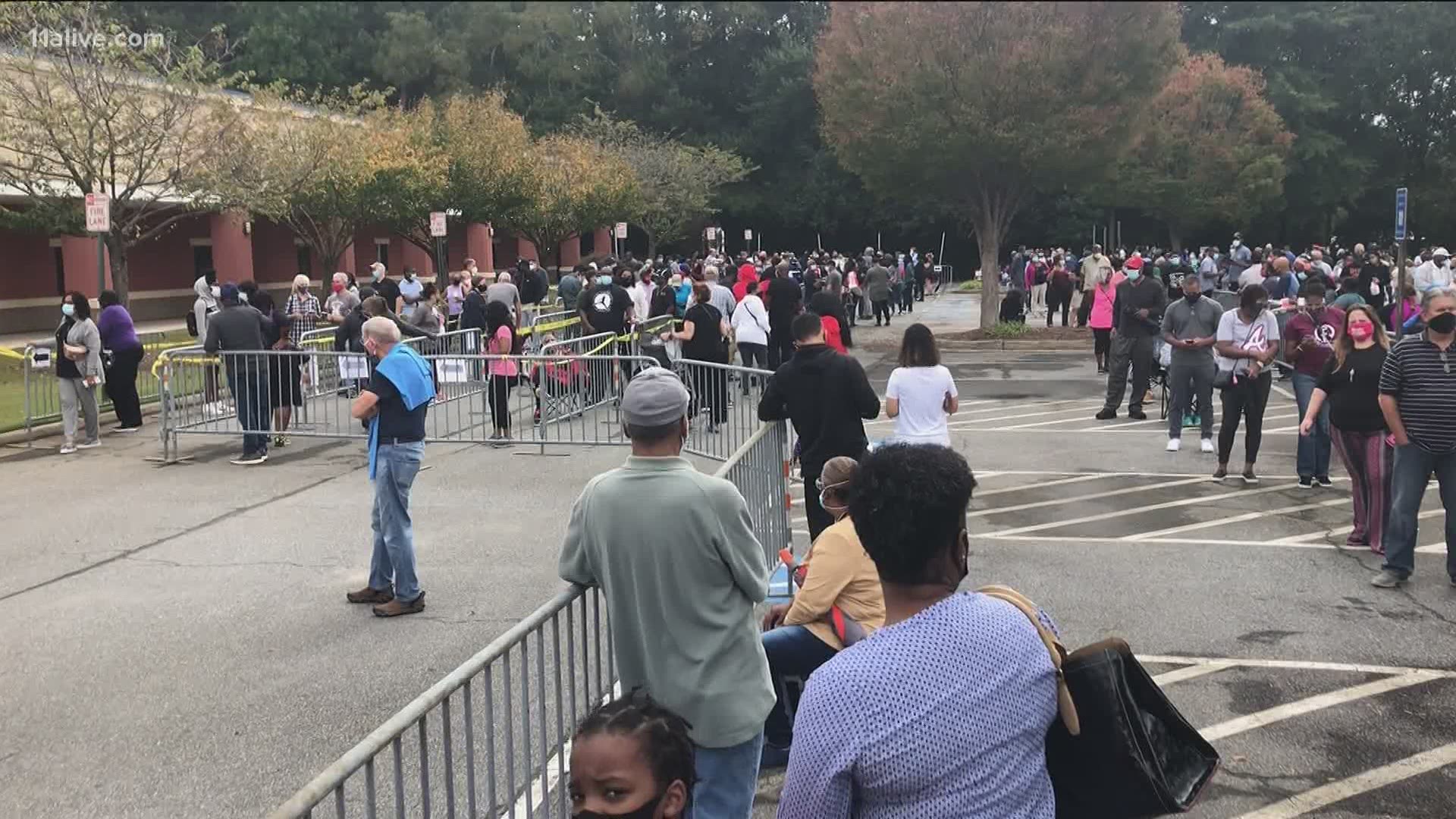 Thousands turned out to cast their ballot on the first day of early voting in Georgia. In many places, that meant long lines.