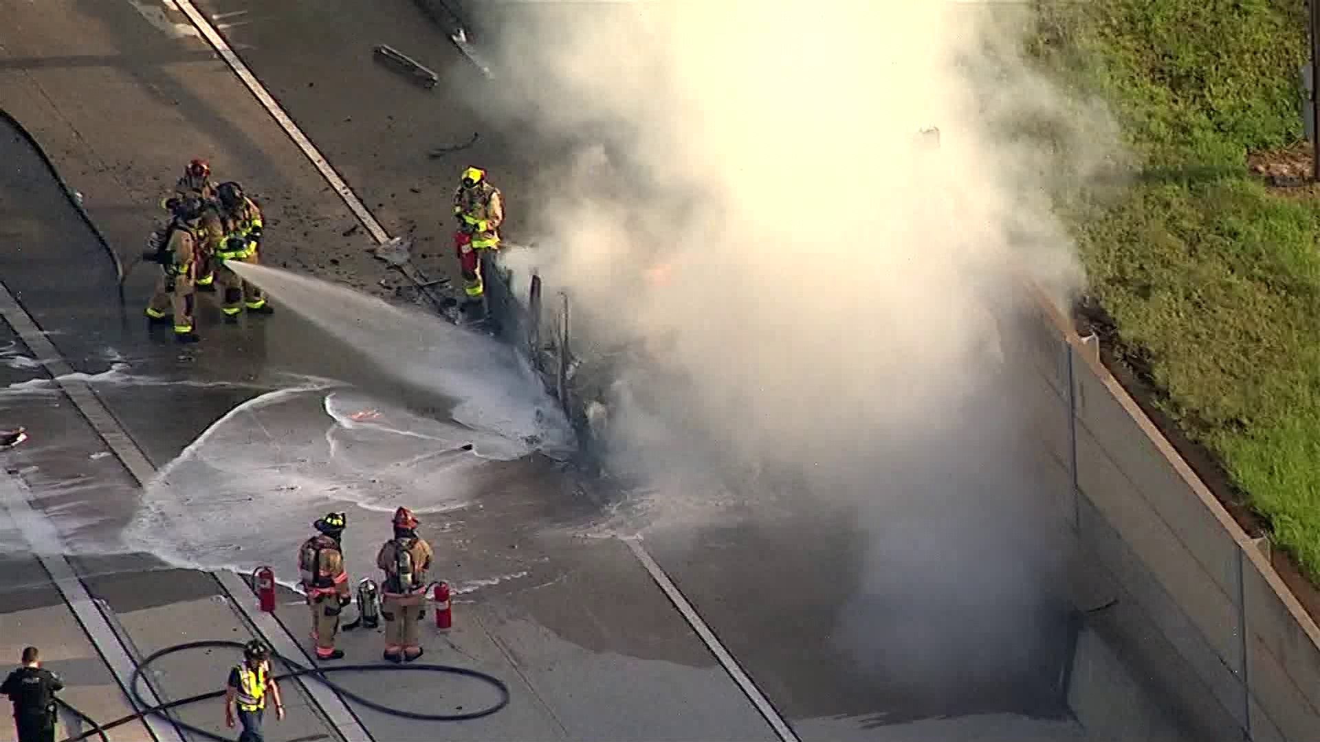 Video showed firefighters trying to put out the flames as oily runoff kept re-igniting.