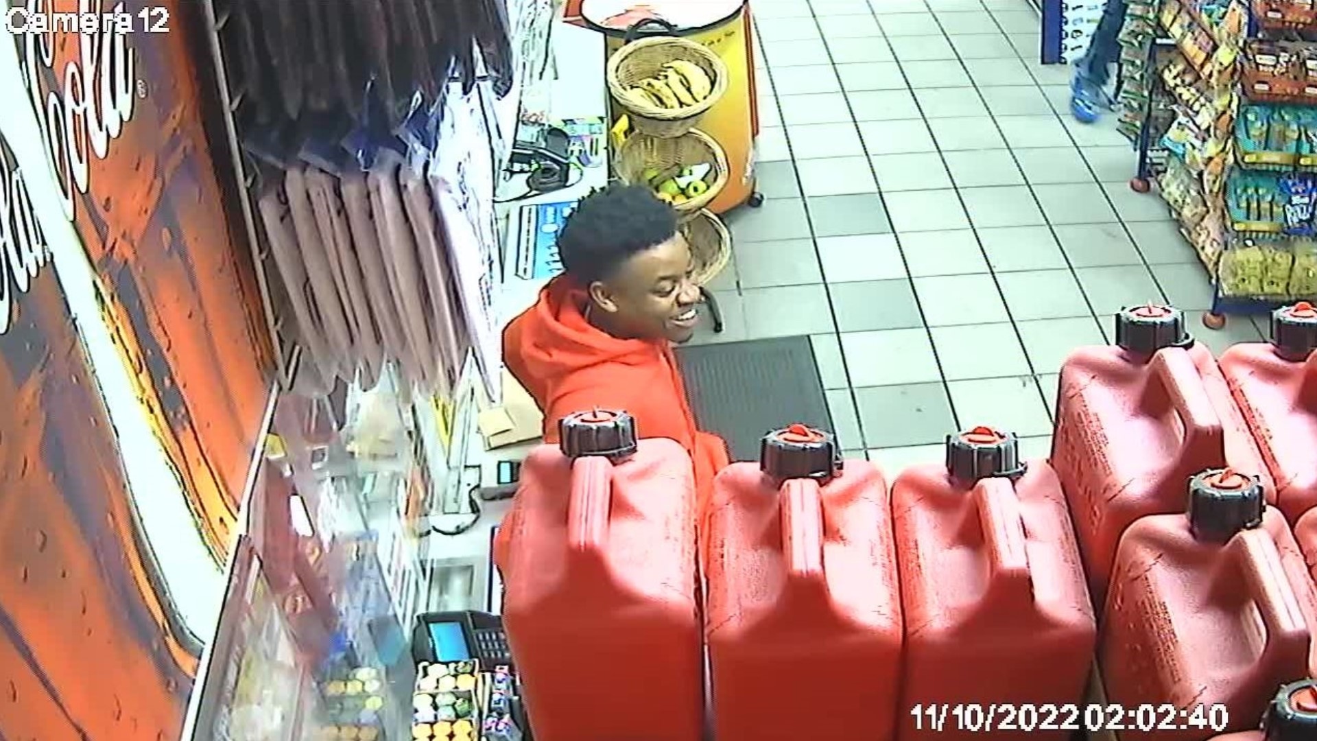Crime Stoppers released new photos of the suspect wearing all red inside the gas station along with a $2,000 reward for anyone that can identify him.