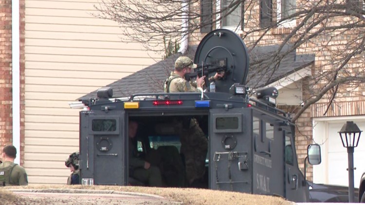 Woman arrested after standoff at Gwinnett home with 4 children ...