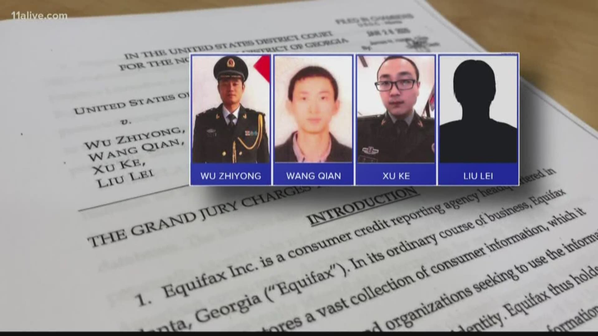 Law enforcement officials say the four are also accused of stealing the company's trade secrets.