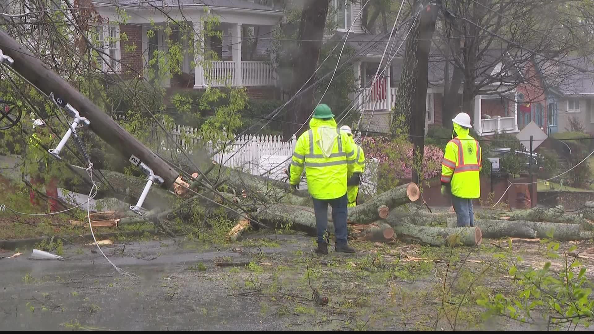 Downed trees knockdown power poles, disrupt electricity in several neighborhoods.