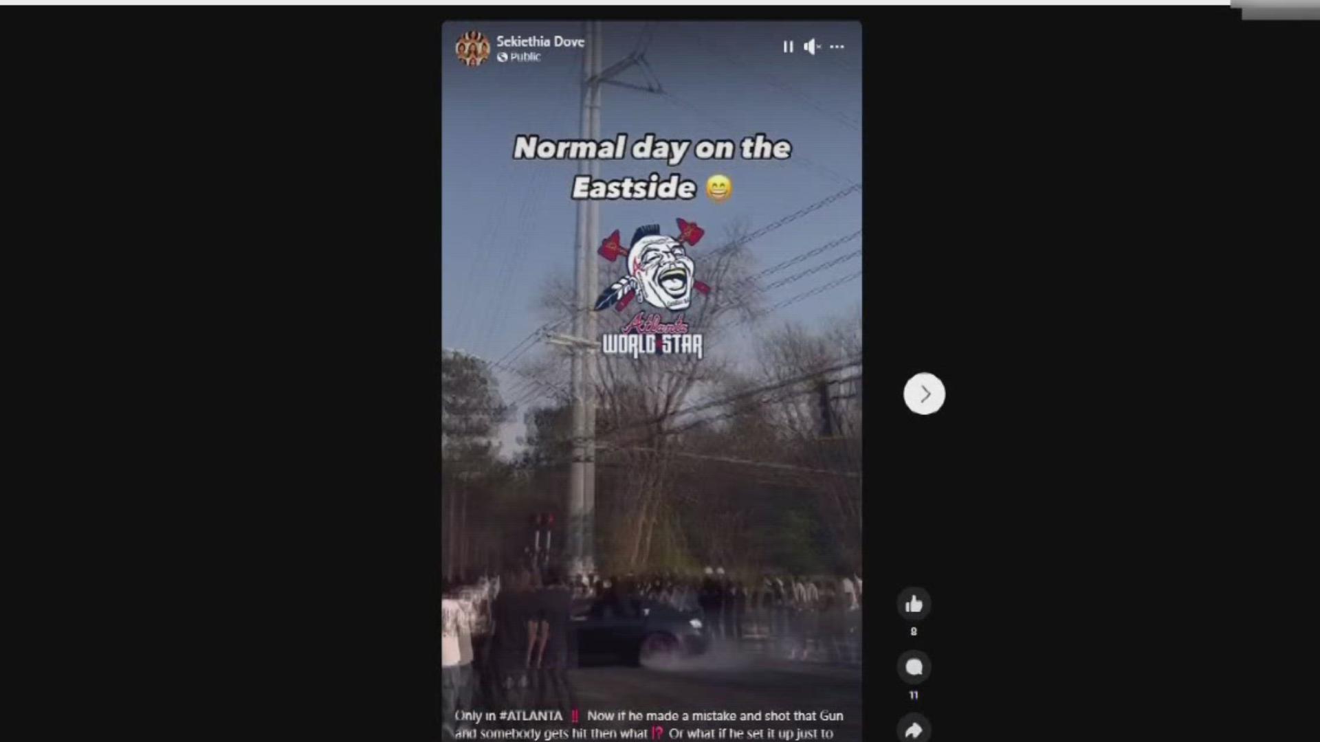 Video shows people hanging out of cars with guns, shutting down a  dangerous intersection. 