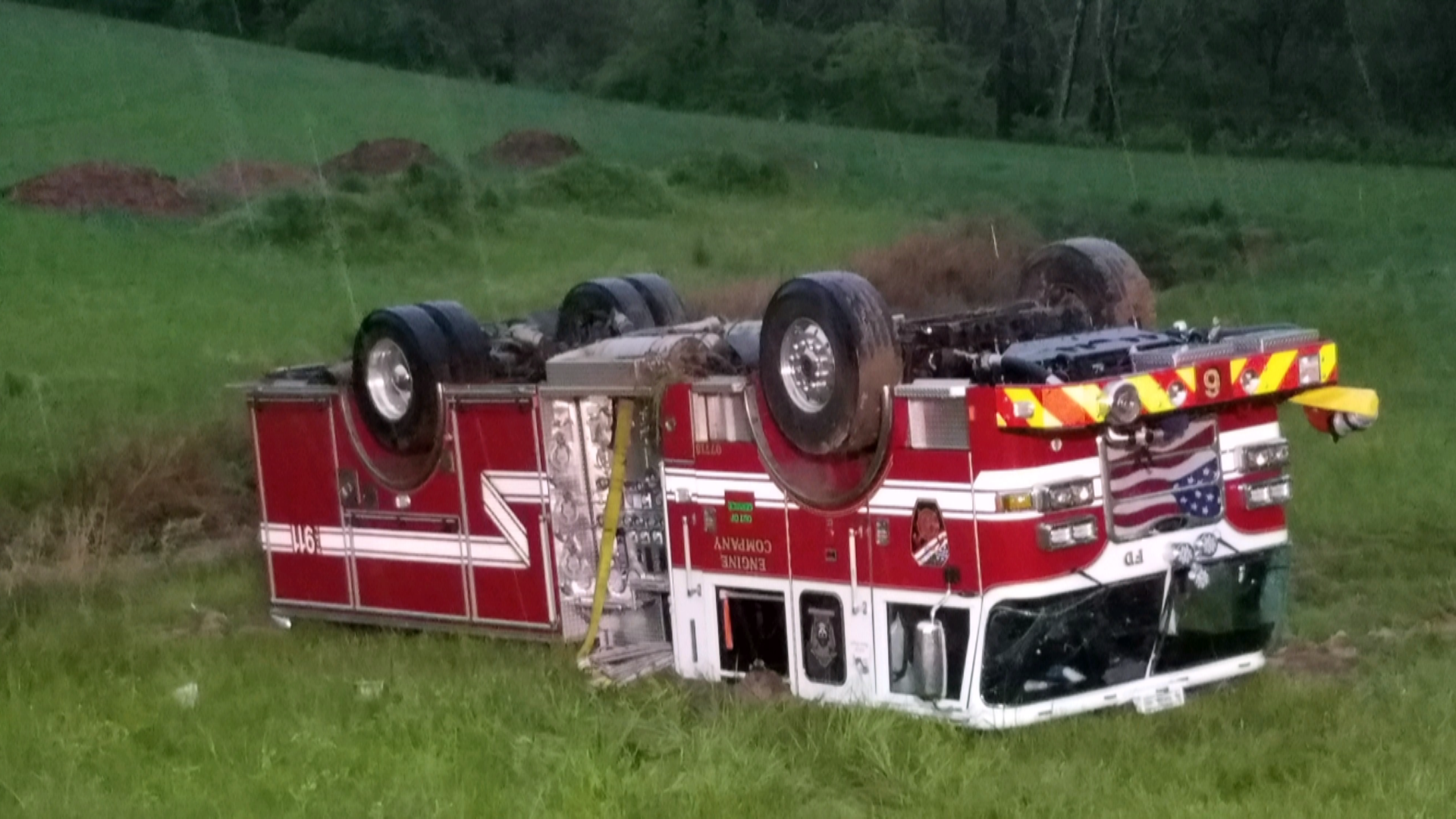 Three firefighters are recovering from injuries after their truck flipped upside down while responding to a house fire.