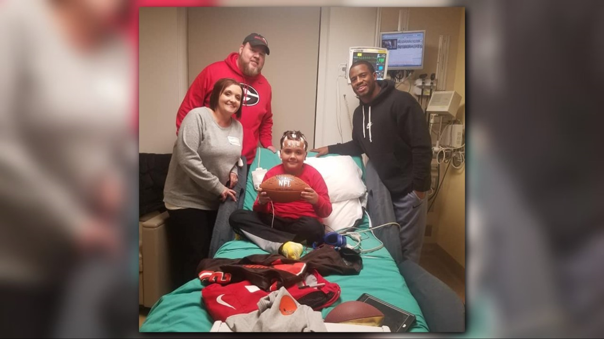 One young UGA fan received the surprise of a lifetime when his favorite football walked into his clinic room.