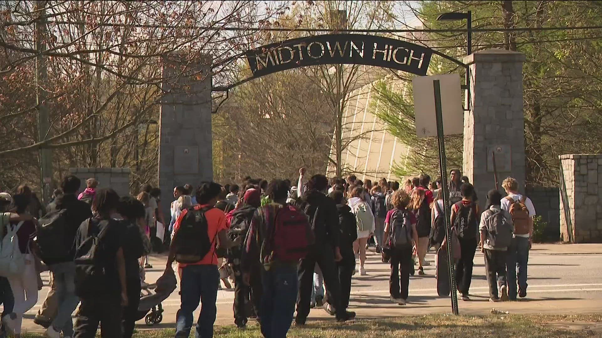 Hundreds of students staged a walkout protest Friday at Midtown High School over a rezoning plan proposed by Atlanta Public Schools.