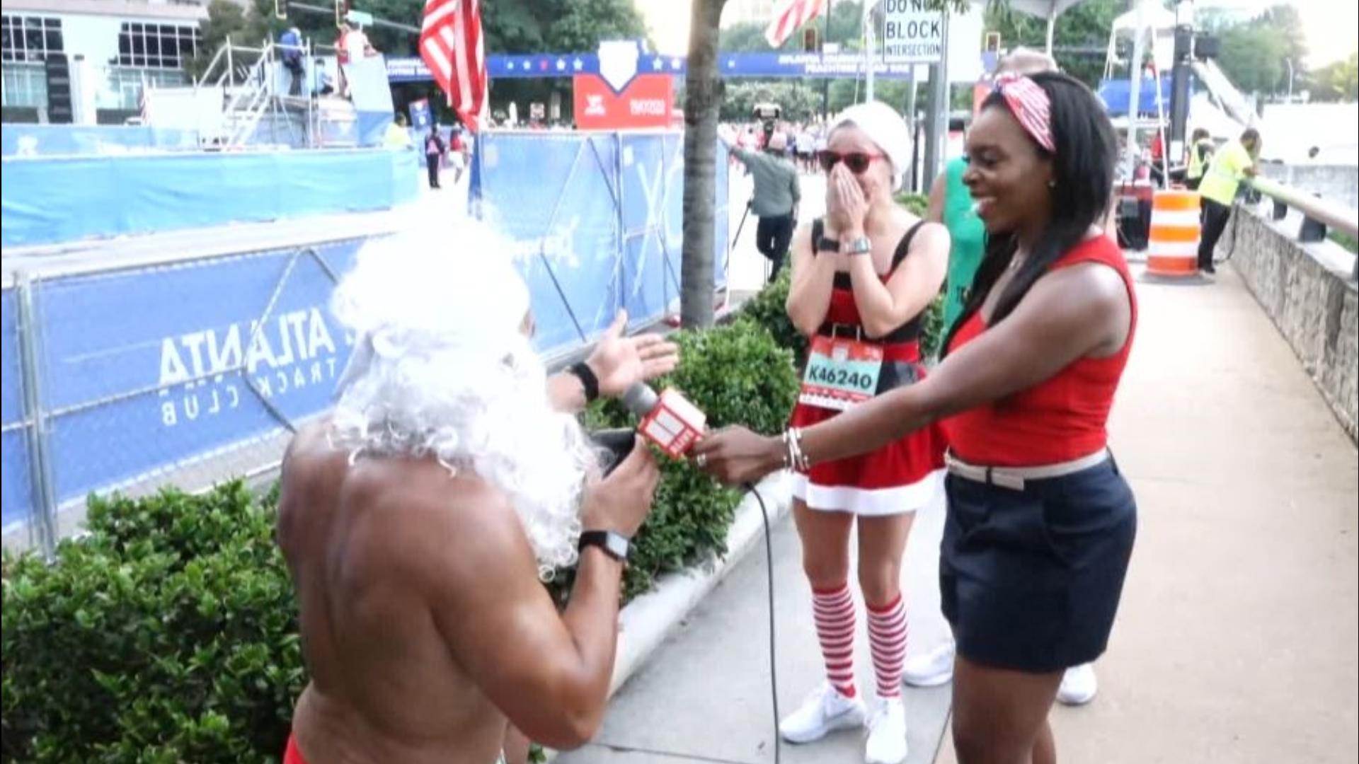 A Peachtree Road Race runner who dresses as a hulked-out Santa every year proposed to his girlfriend this year!