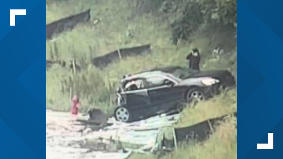 Nasty crash pancakes back portion of car on I-285
