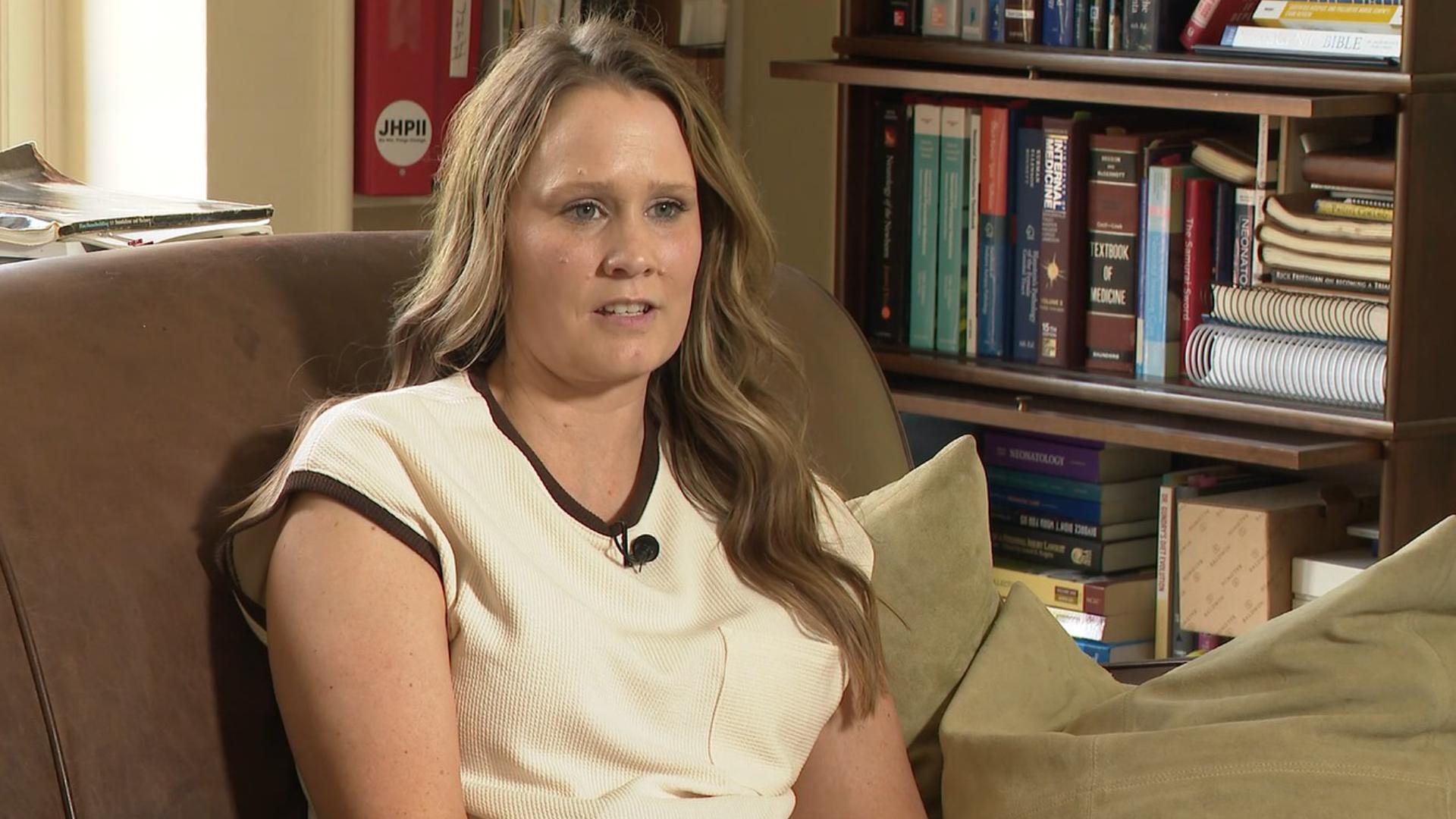 After a man filmed her inside a dressing room, this mom is pushing for full-length doors to protect future shoppers.