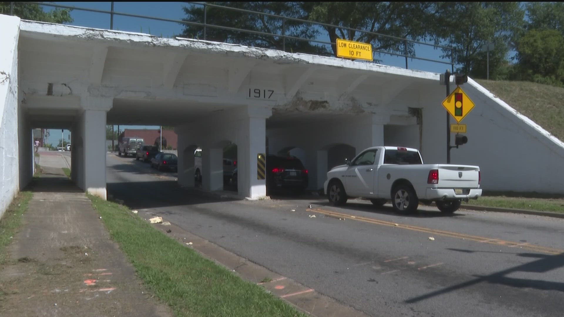 Despite the signage, trucks can't seem to clear the bridge.