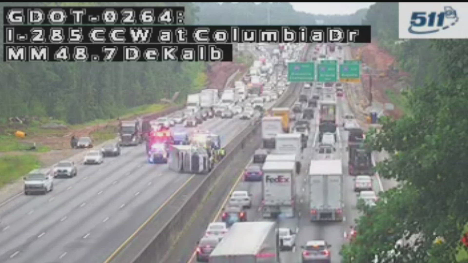 Box truck overturned, blocking lanes on I-285 in DeKalb County; other ...