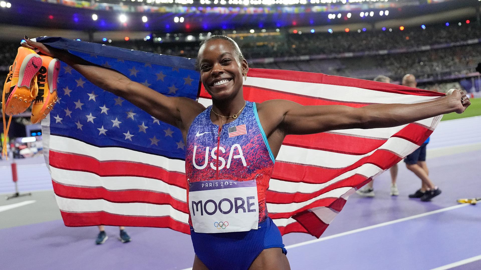 Moore jumped into the record books after she became just the second woman in Olympic history to medal in both the triple jump and long jump at the same Games.