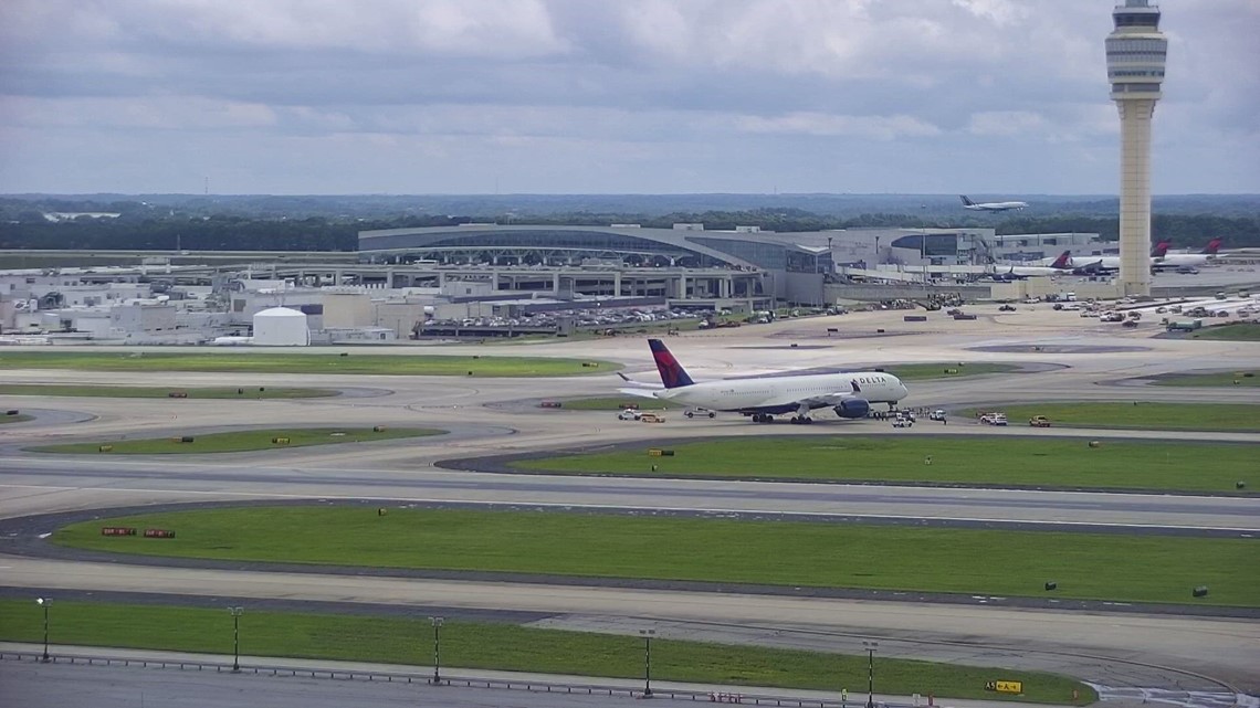 Emergency vehicles respond to Delta plane at Atlanta Airport tarmac ...