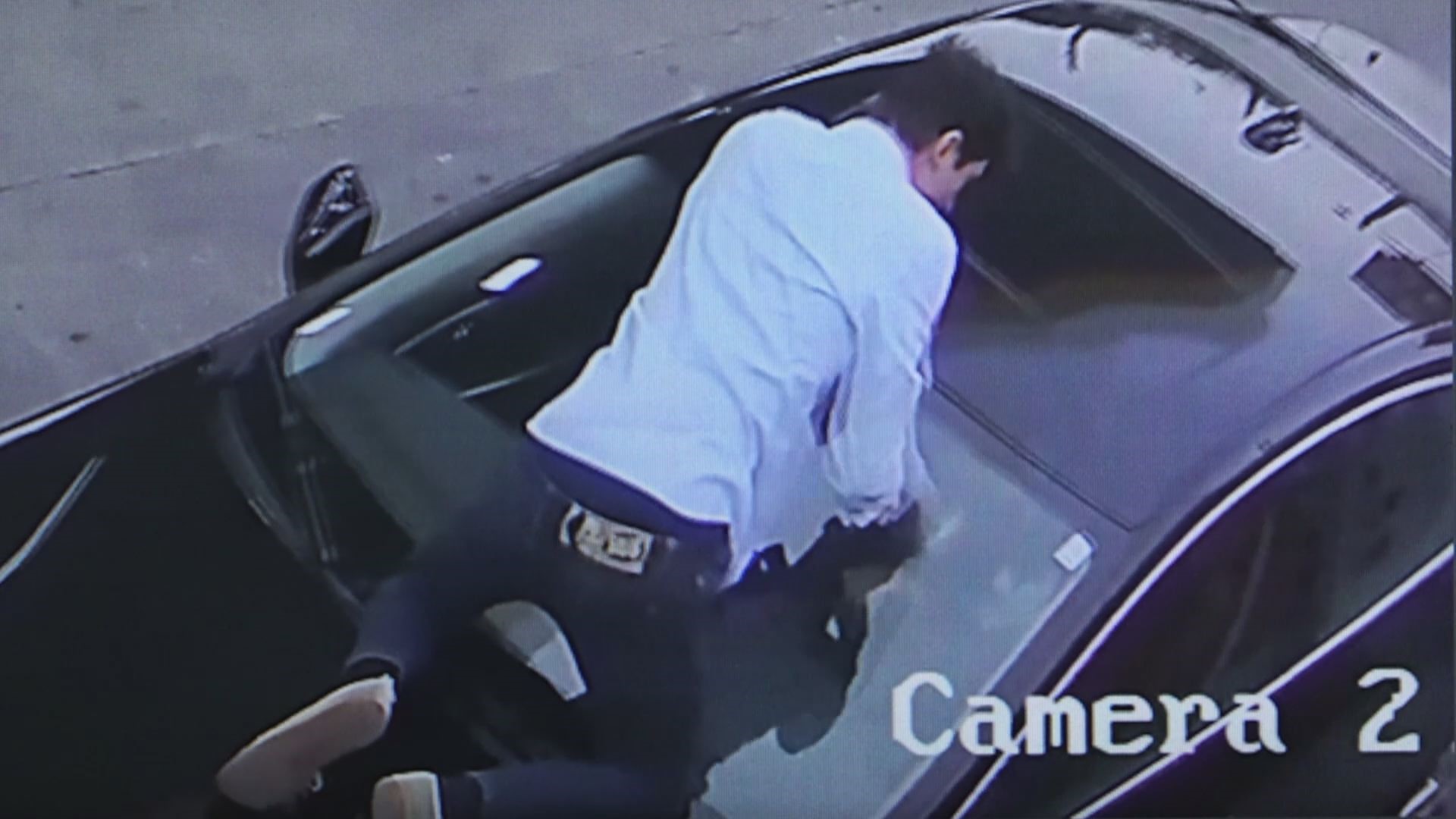 Exclusive: Surveillance video shows driver jumping on car to stop thieves  from stealing it