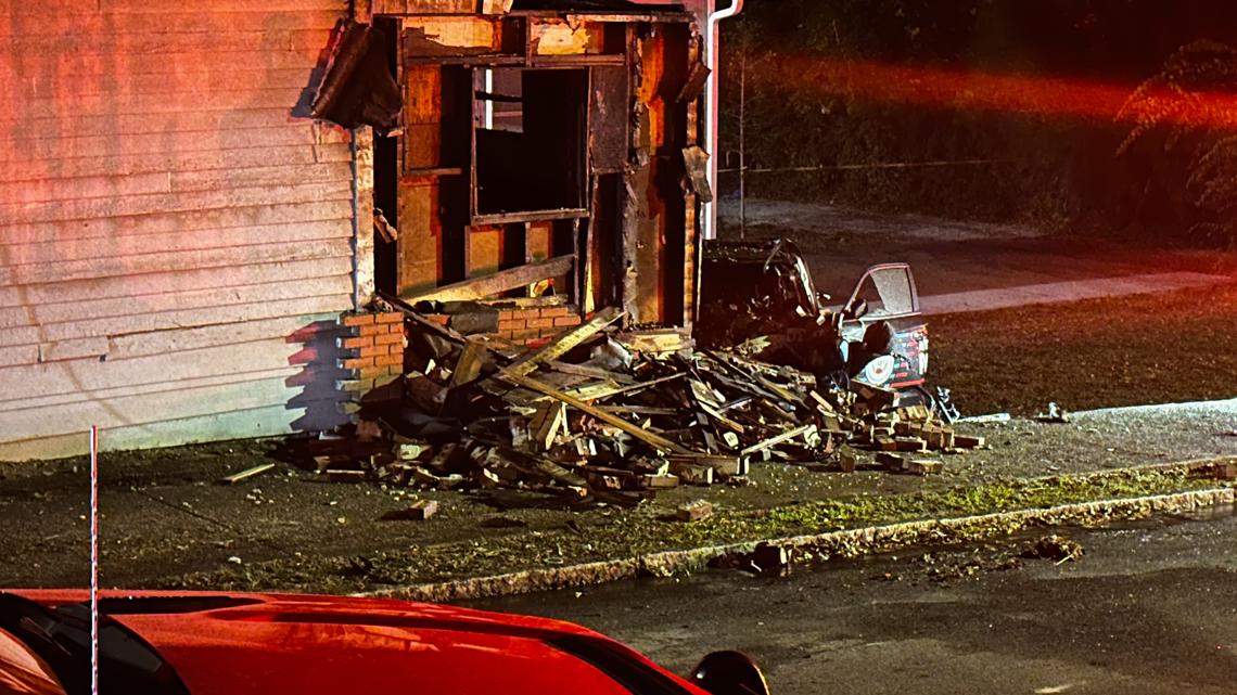 APD: Witnesses pull officer from car after fiery crash into home