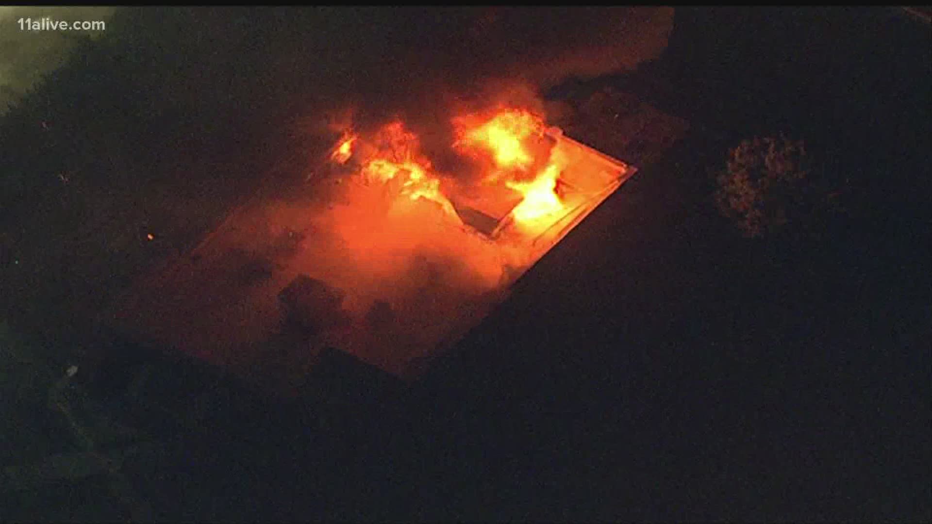 Flames at the Wendy's where Rayshard Brooks was killed in a police shooting break through the roof.