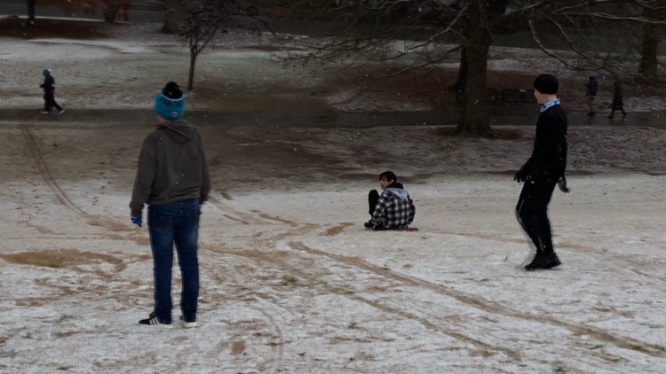 Residents take on the 'slopes' at Piedmont Park amid wintry weather